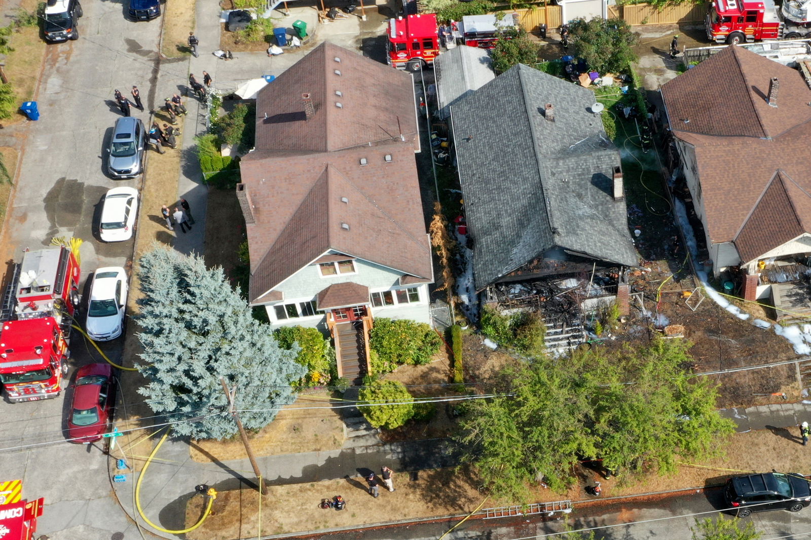 Seattle police and fire teams respond to a fire and reported shooting at a Wallingford home in the 1000 block of North 48th Street in Seattle on Sept. 2, 2023. (Karen Ducey/The Seattle Times/TNS)