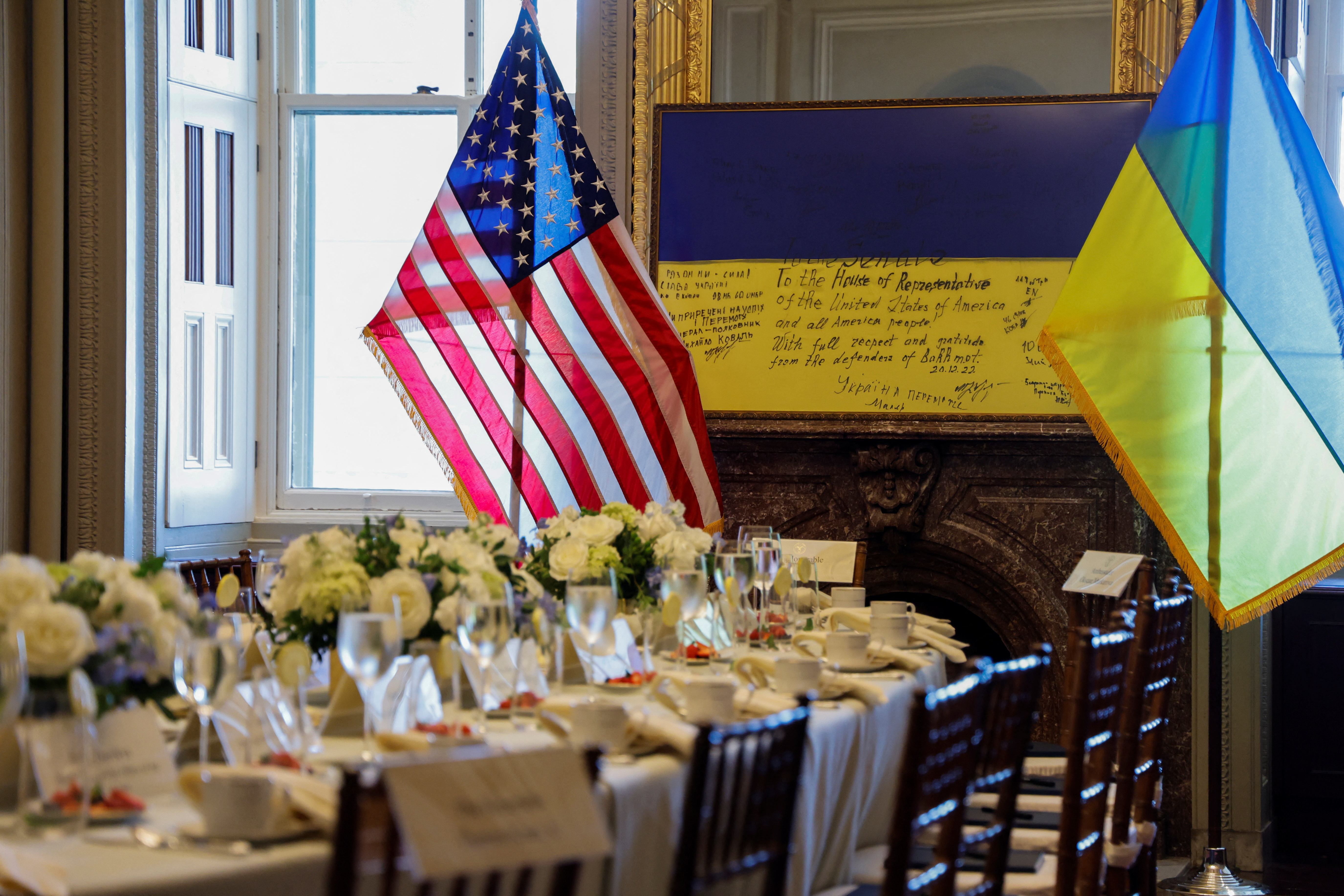 A framed flag signed by front-line Ukrainian fighters in Bakhmut and presented to the U.S. Congress in 2022, sits at one end of the table where Ukrainian President Volodymyr Zelenskiy will meet privately with U.S. House Speaker Kevin McCarthy (R-CA) and other congressional leaders on a visit to the U.S. Capitol in Washington, September 21, 2023. 