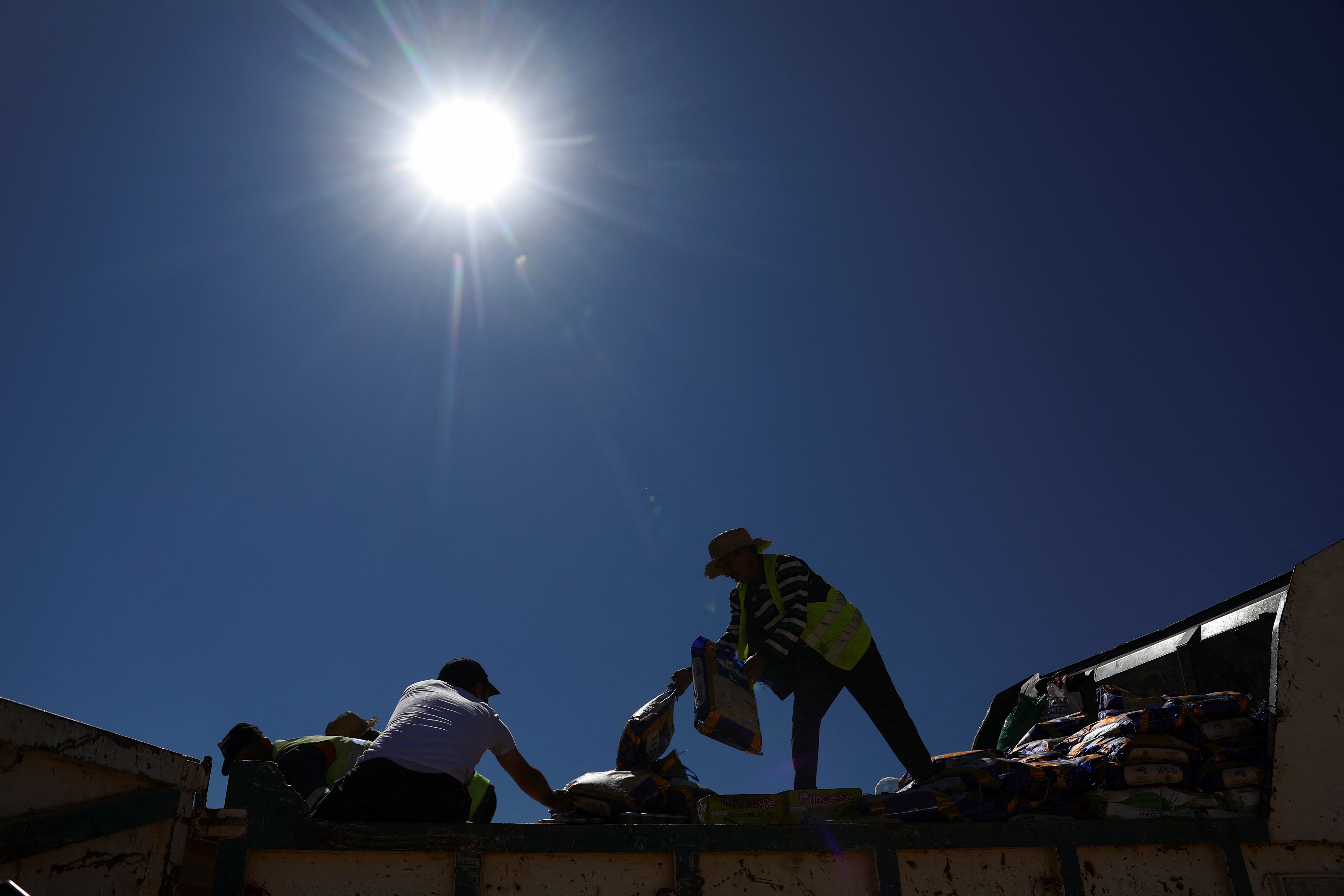 People deliver aid, in the aftermath of a deadly earthquake in Moulay Brahim, Morocco, September 10, 2023. REUTERS/Hannah McKay