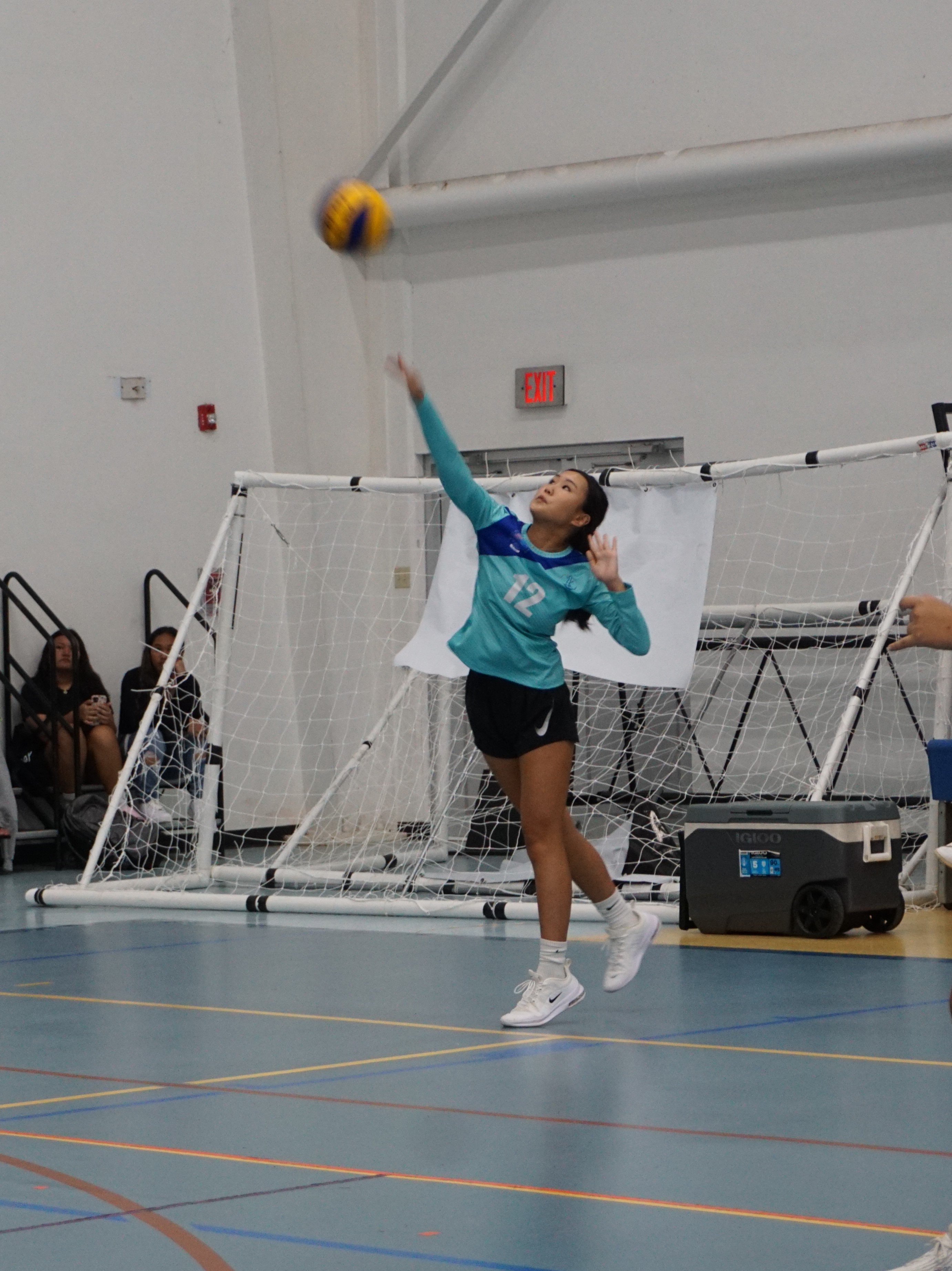 SIS II's Irin Chung connects the overhead serve against MHS II during an opening game of the NMIVA-PSS Girls High School Volleyball League SY 23-24 on Tuesday at the Marianas High School gym.