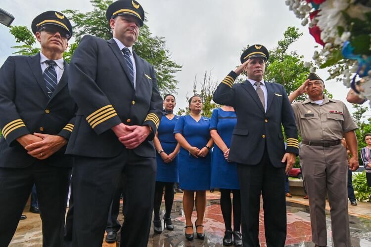 United Airlines personnel pay respects after hanging a wreath representing the Pennsylvania United Airlines Fight 93 at the Peace Ceremony & Tribute in remembrance of Sept. 11 Monday Sept. 11, 2023 in Harmon.