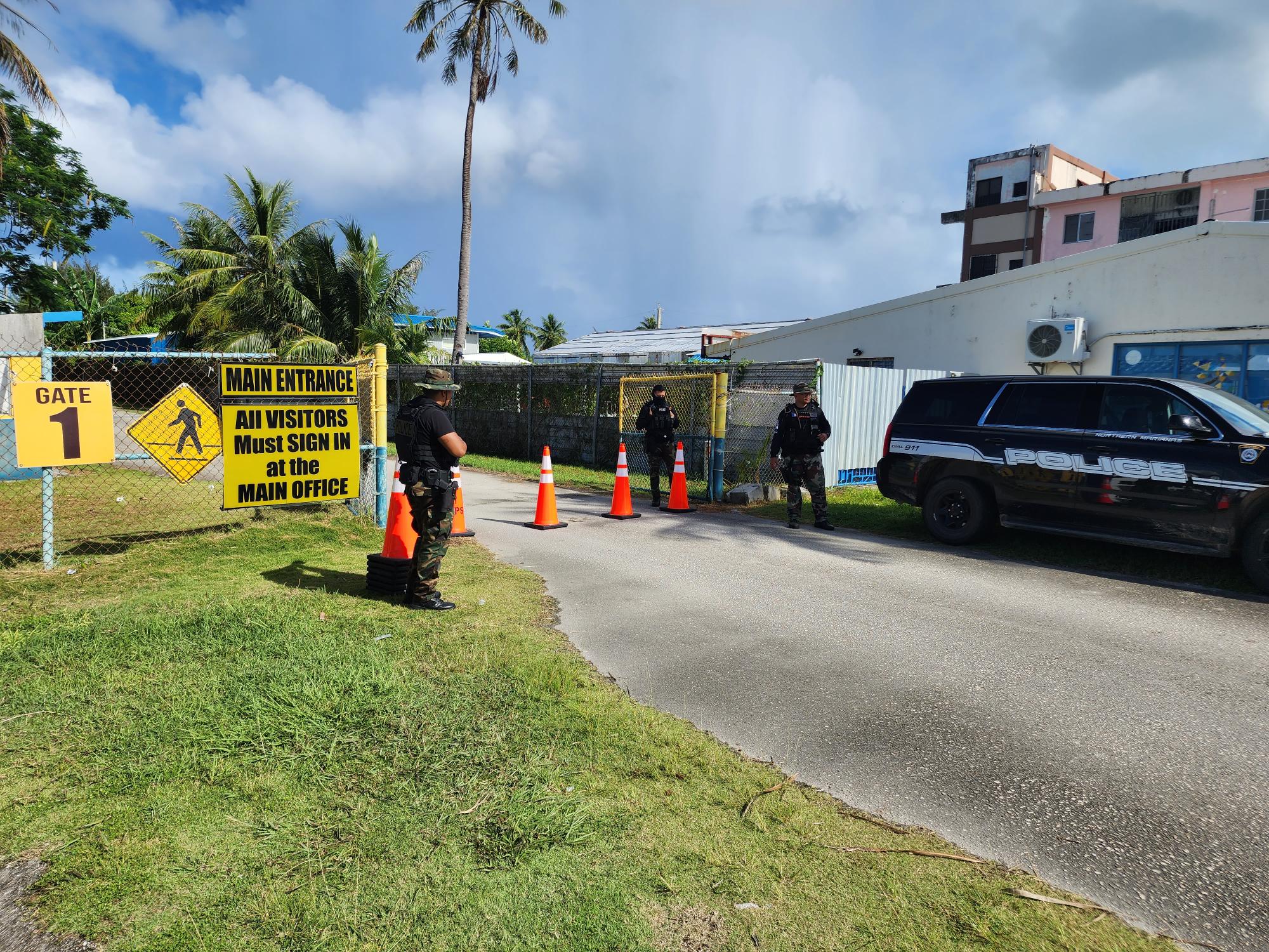 The DPS-Rapid Response Team sets up a checkpoint at the entrance of Hopwood Middle School on Monday morning.