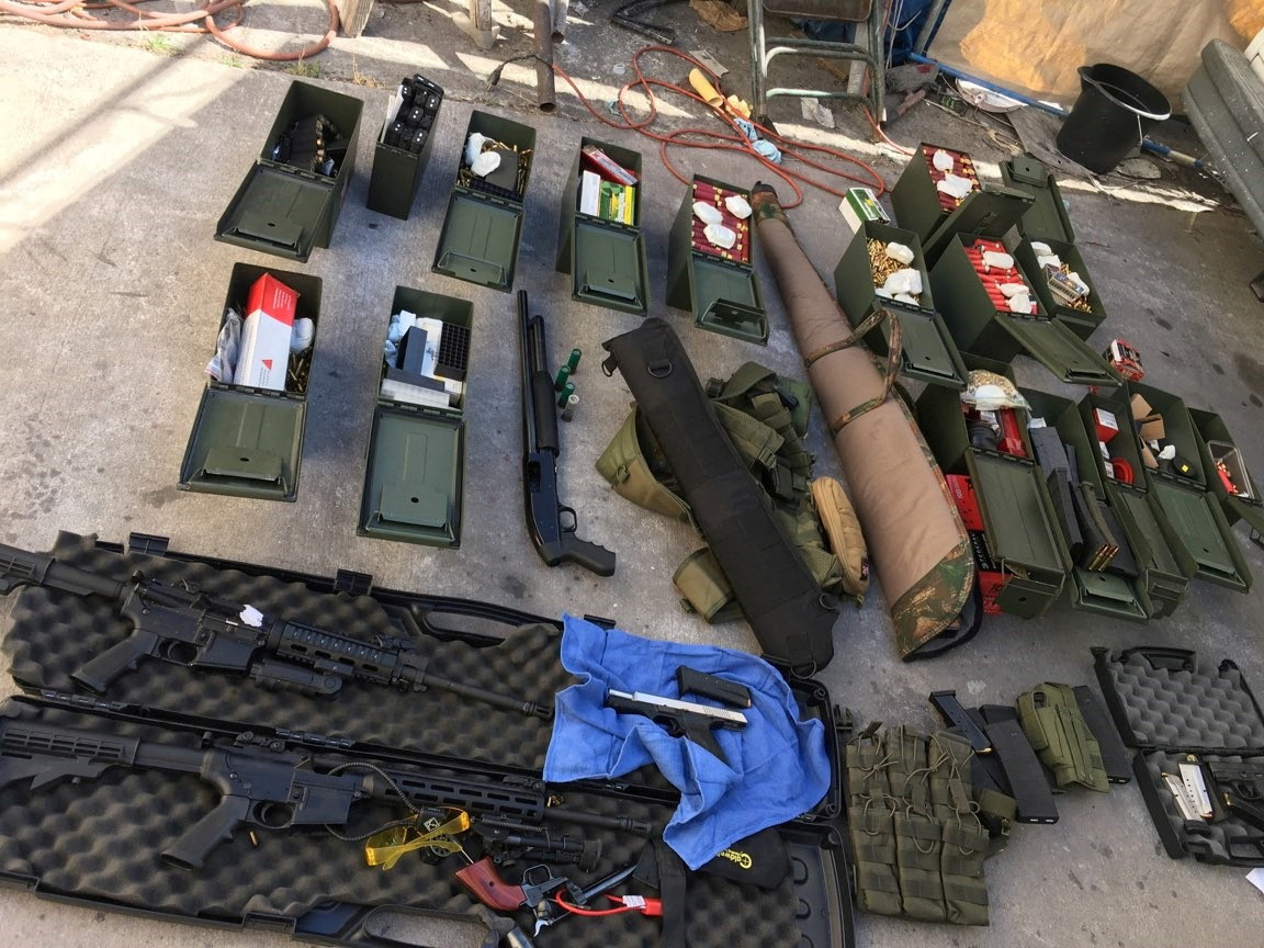 Illegal high-capacity magazines and an assault rifle along with multiple guns, ammunition are seen in this Long Beach Police Department (LBPD) photo in Long Beach, California, U.S., released on August 21, 2019.