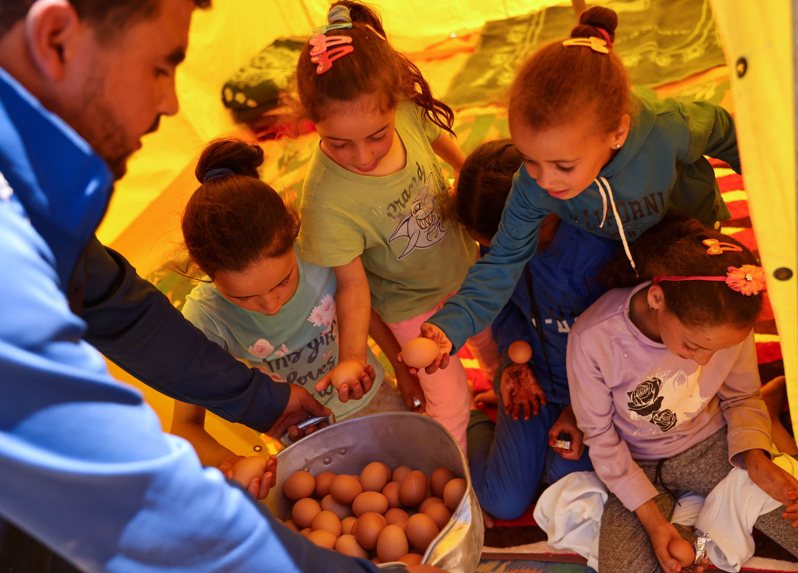 Children receive food, in the aftermath of a deadly earthquake, in Adassil, Morocco, September 11, 2023. 