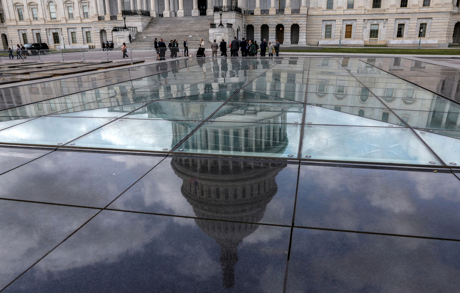 The U.S. Capitol dome is seen in a reflection outside the United States Capitol building in Washington, U.S., September 22, 2023. 