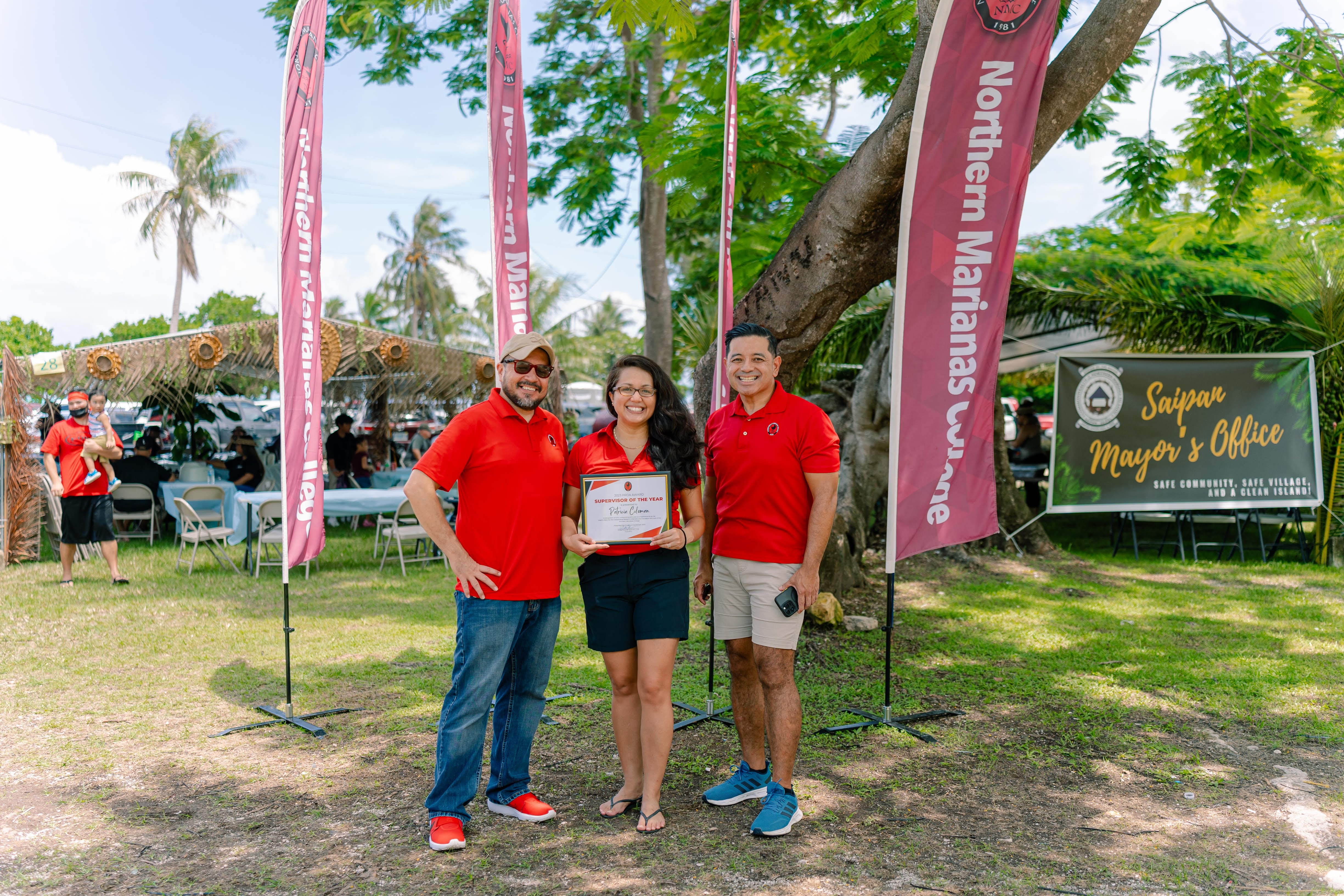 Interim Dean for NMC’s Cooperative Research, Extension, and Education Services Patricia Coleman, center, with NMC President Galvin Deleon Guerrero, EdD, left, and NMC Vice President for Administration and Advancement Frankie Eliptico, right.