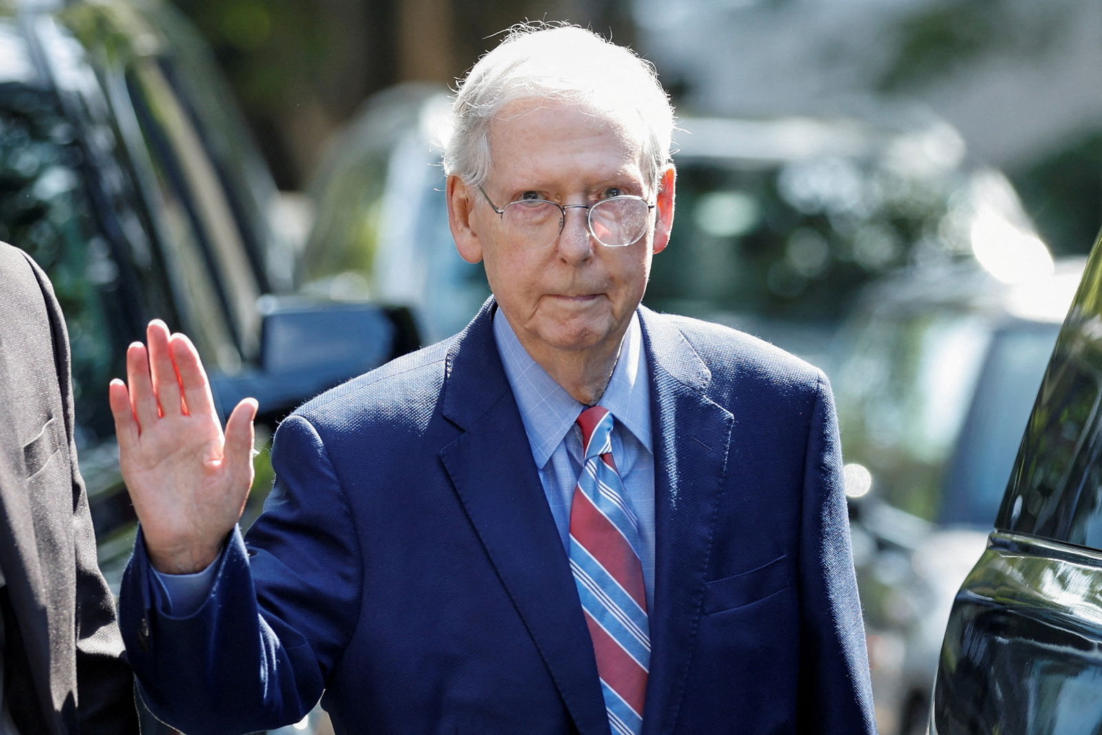 U.S. Senate Minority Leader Mitch McConnell (R-KY) waves as he leaves his Washington house to return to work at the U.S. Senate, less than a week after he froze for more than 30 seconds while speaking to reporters at an event in his home state of Kentucky, in Washington, U.S., September 5, 2023. REUTERS/Jonathan Ernst