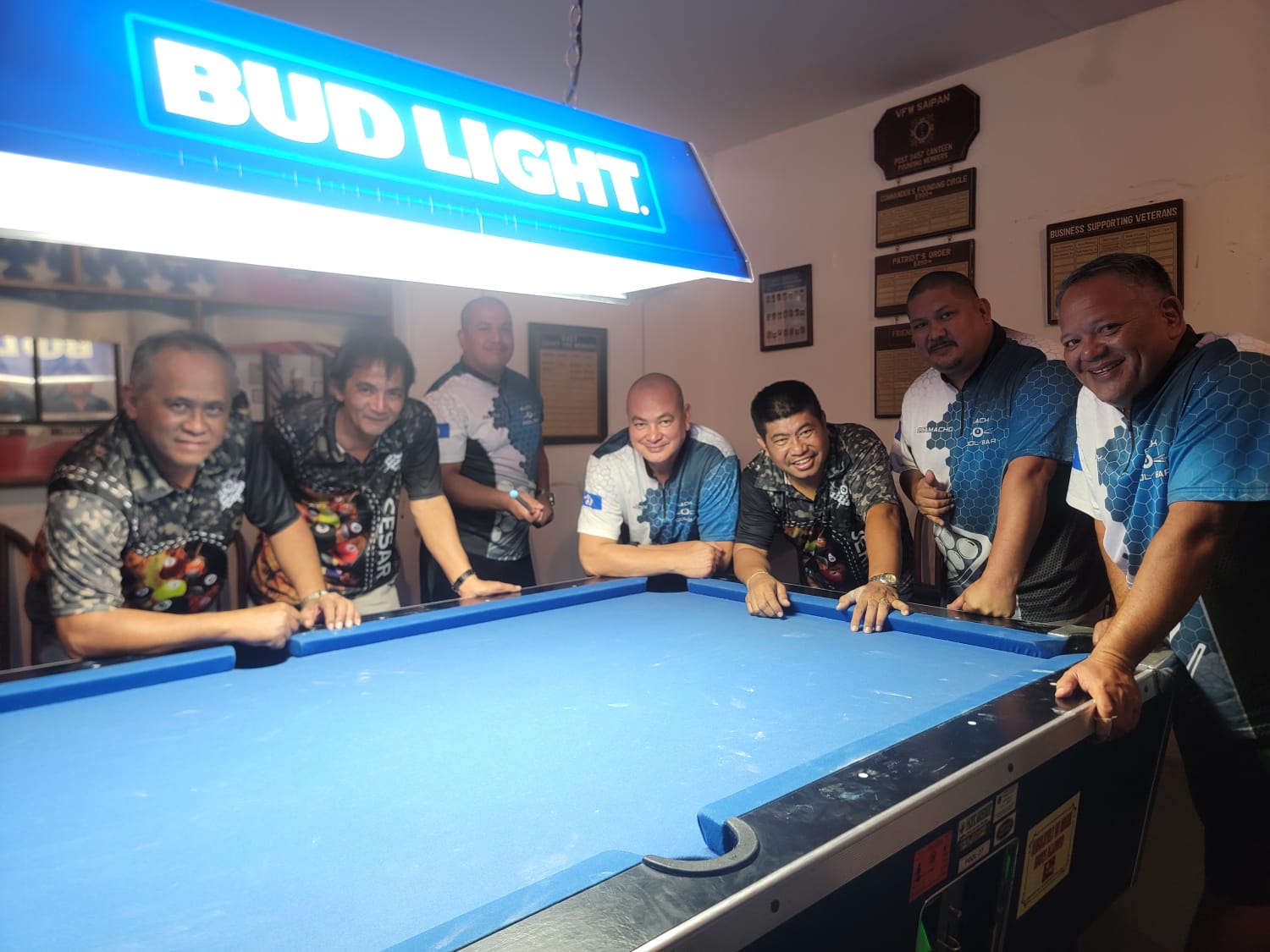 The Rendezvous Warriors and Black 8 Rack N Roll players pose for a photo during their game in the Tuesday division of the 2023 SBA Budweiser Open 8-Ball League at the VFW Bar.