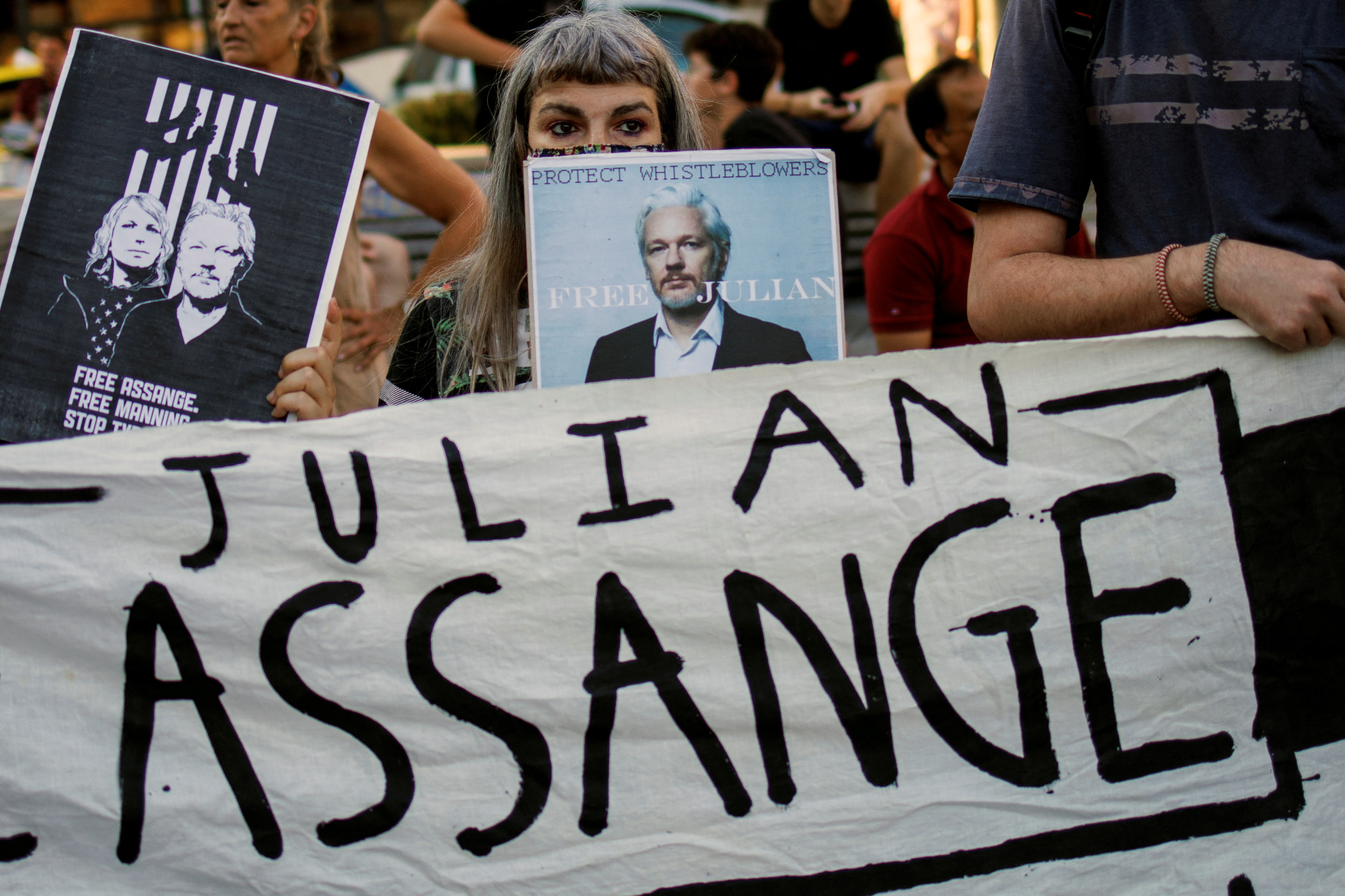 A supporter holds a poster depicting Julian Assange during a protest against the extradition of WikiLeaks' founder from Britain to the U.S., in Athens, Greece, June 20, 2022. 