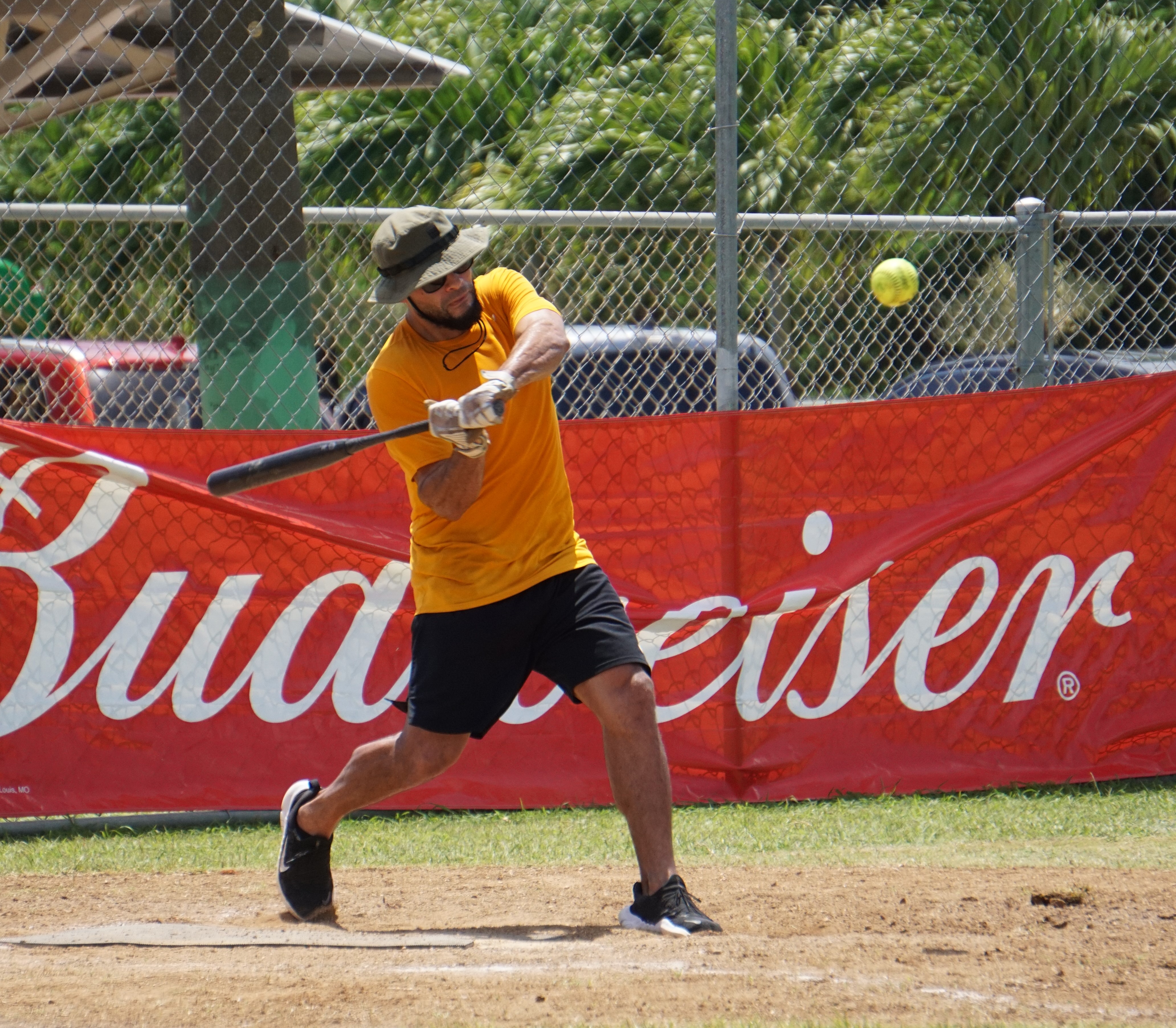 Payday Hao's Eli Aughenbaugh hits  a double during an Open League game of the Budweiser Belau Amateur Softball Association at the Dandan baseball field.