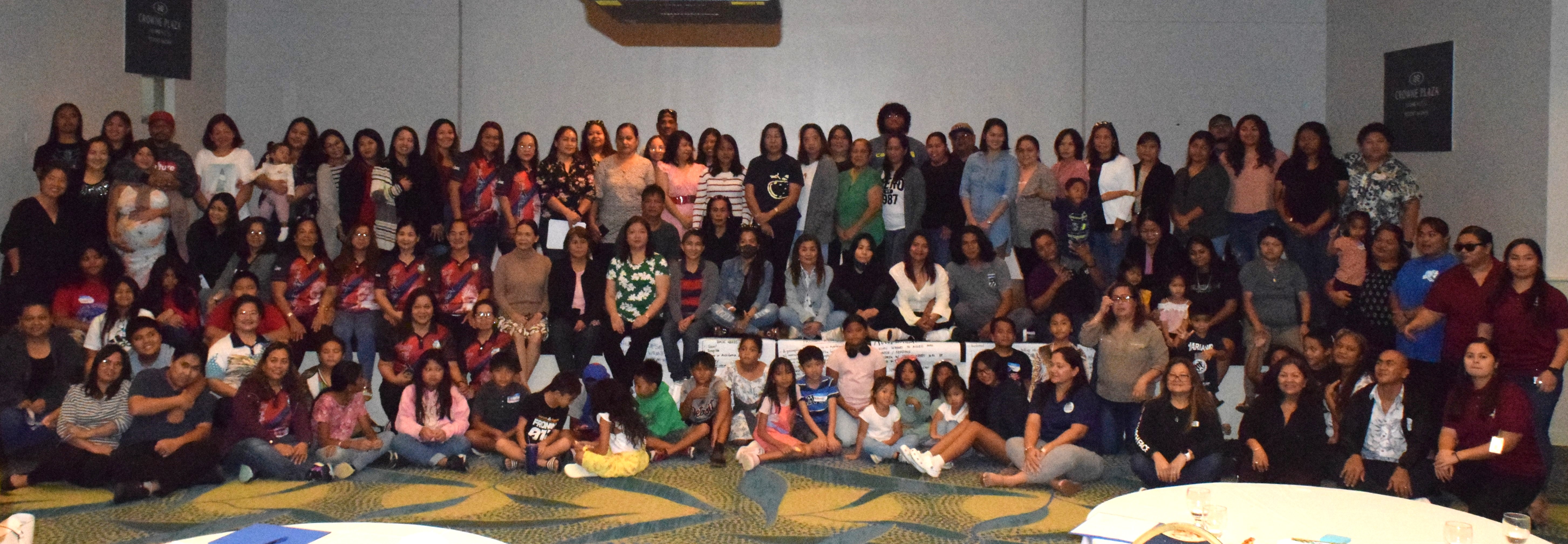 The participants of the 2023 Parent Development Workshop hosted by the Division of Youth Services pose for photo at Crowne Plaza Resort's Hibiscus Hall on Saturday.