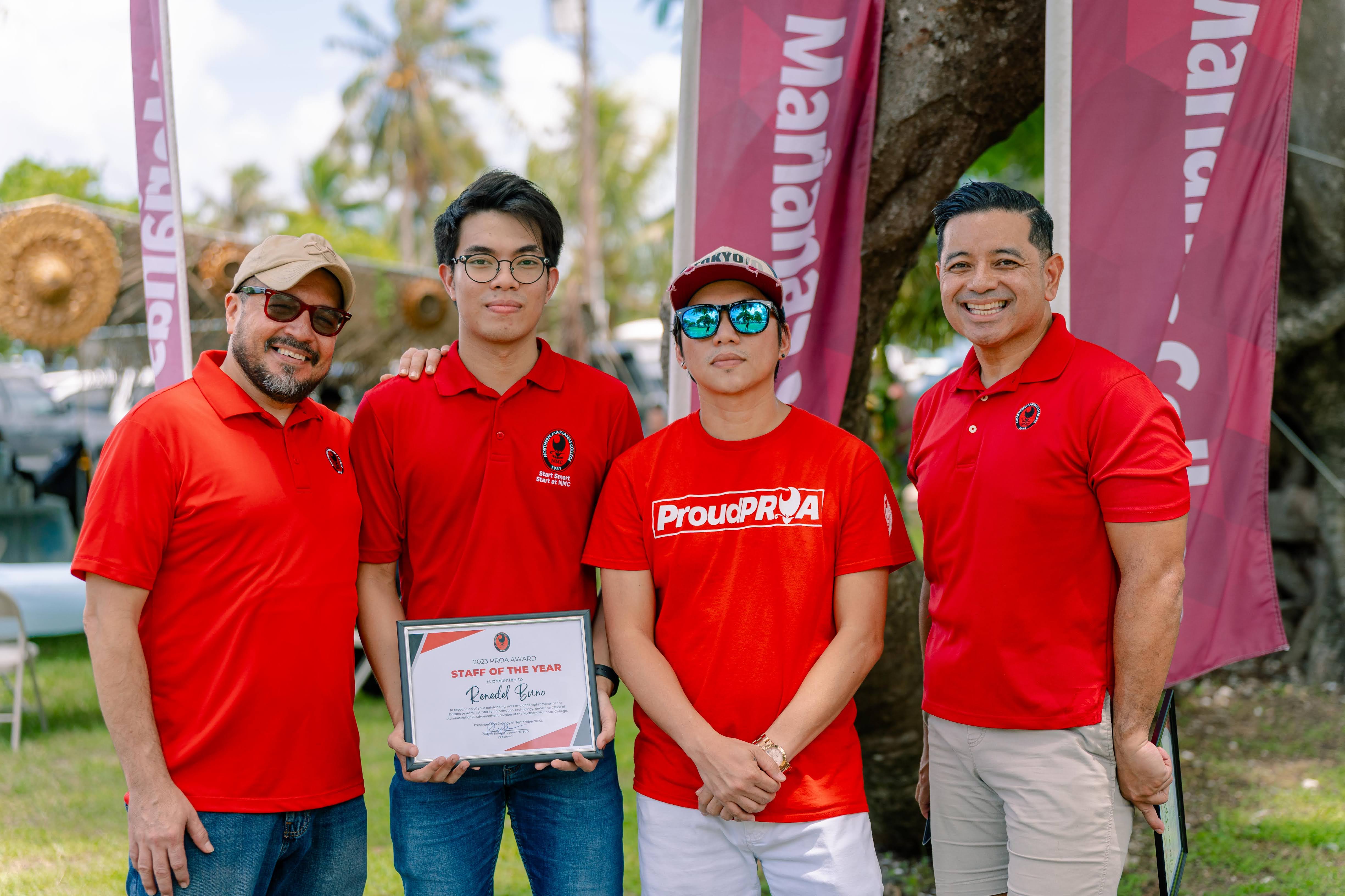 Renedel Buno, Staff of the Year and Database Administrator, center, with NMC President Galvin Deleon Guerrero, EdD, Jerome Ortiz, Interim Information Technology director and Employee of the Year, and Frankie Eliptico, NMC vice president for administration and advancement.