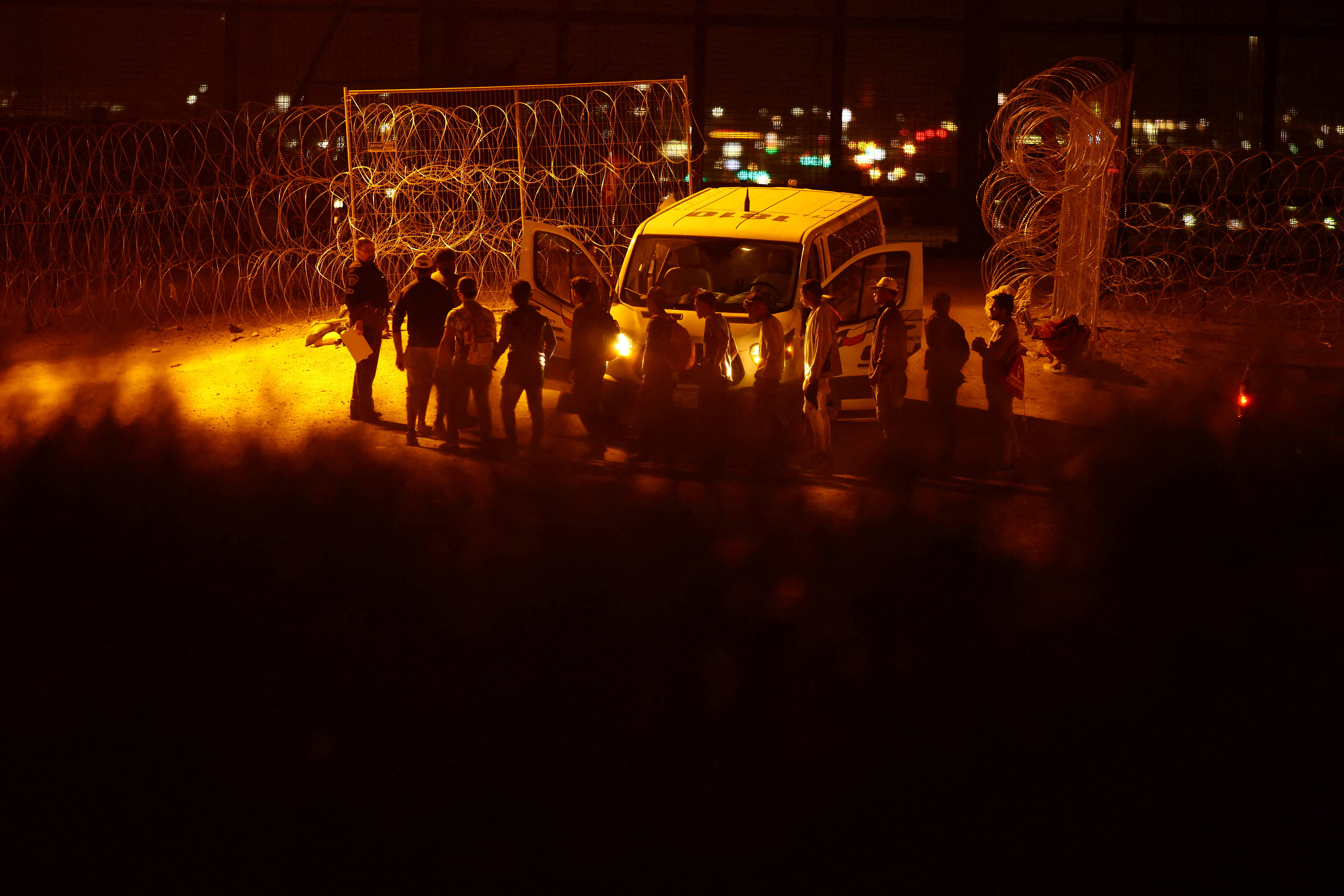 Migrants seeking asylum in the United States gather near a border wall on the banks of the Rio Bravo River, on the border between the U.S. and Mexico, as seen from Ciudad Juarez, Mexico September 19, 2023. 