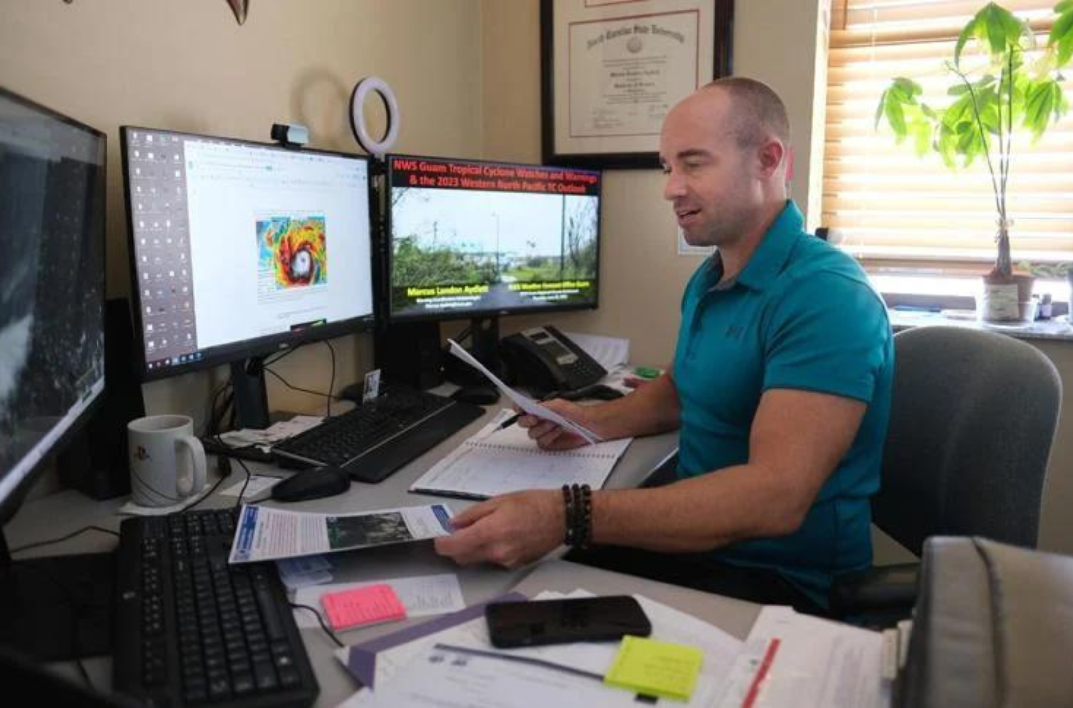 Landon Aydlett, chief meteorologist with the local National Weather Service Forecast Office, is shown at his Tiyan office on July 3, 2023. The agency said Tropical Storm Kirogi, located about 640 miles east of Guam as of Thursday Aug. 31, 2023, isn't expected to bring any inclement weather to the island as it moves west. 