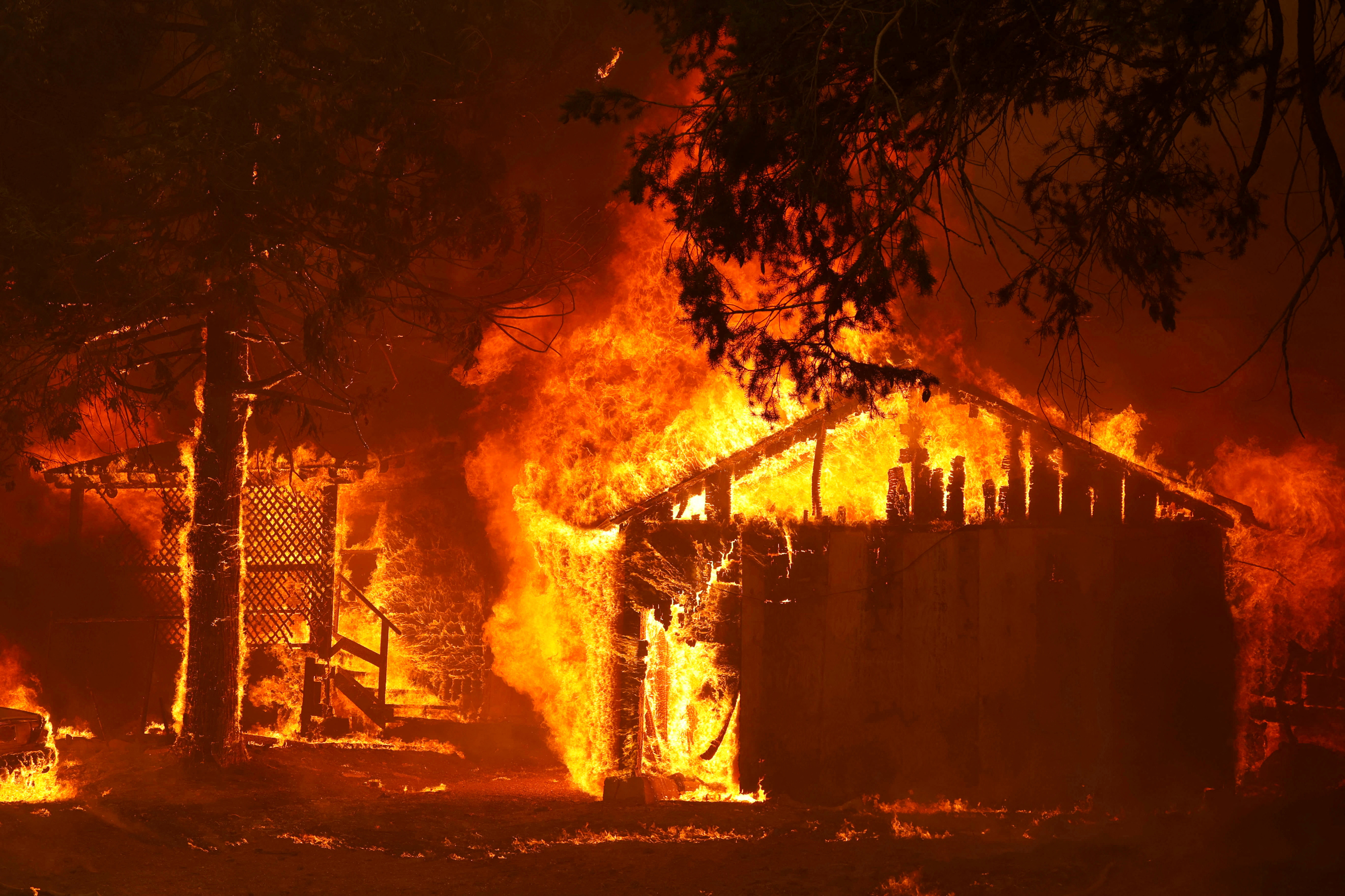 A house is fully engulfed by flames at the Dixie Fire, a wildfire near the town of Greenville, California, U.S. August 5, 2021. 