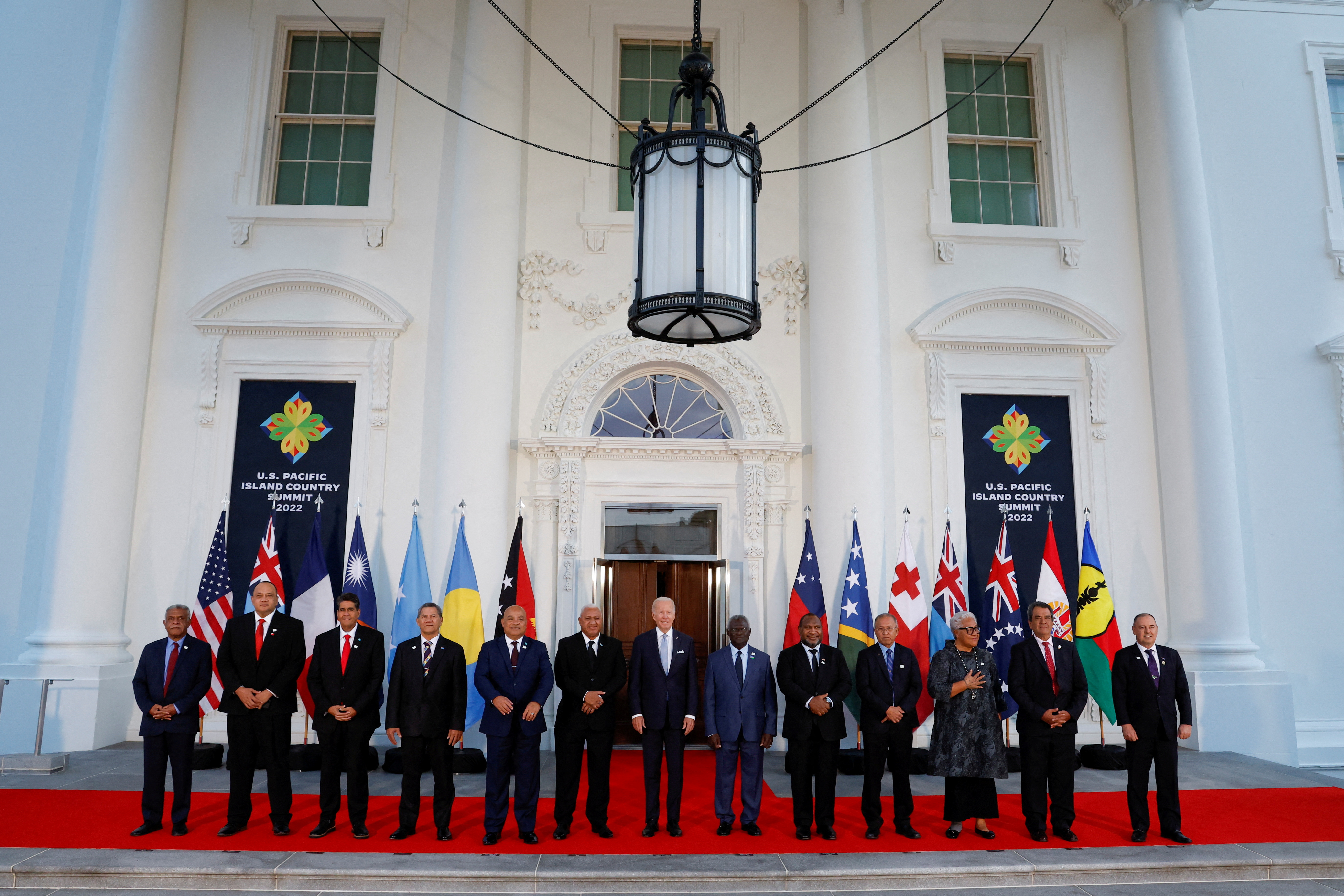 U.S. President Joe Biden poses with leaders from the U.S.- Pacific Island Country Summit, New Caledonia's President Louis Mapou, Tonga's Prime Minister Hu'akavemeiliku Siaosi Sovaleni, Palau's President Surangel Whipps Jr., Tuvalu's Prime Minister Kausea Natano, Federated States of Micronesia's President David Panuelo, Fiji's Prime Minister Frank Bainimarama, Solomon Islands Prime Minister Manasseh Sogavare, Papua New Guinea's Prime Minister James Marape, Marshall Islands President David Kabua, Samoa's Prime Minister Fiame Naomi Mata'afa, French Polynesia's President Edouard Fritch and Cook Islands Prime Minister Mark Brown at the White House in Washington, U.S. September 29, 2022. 