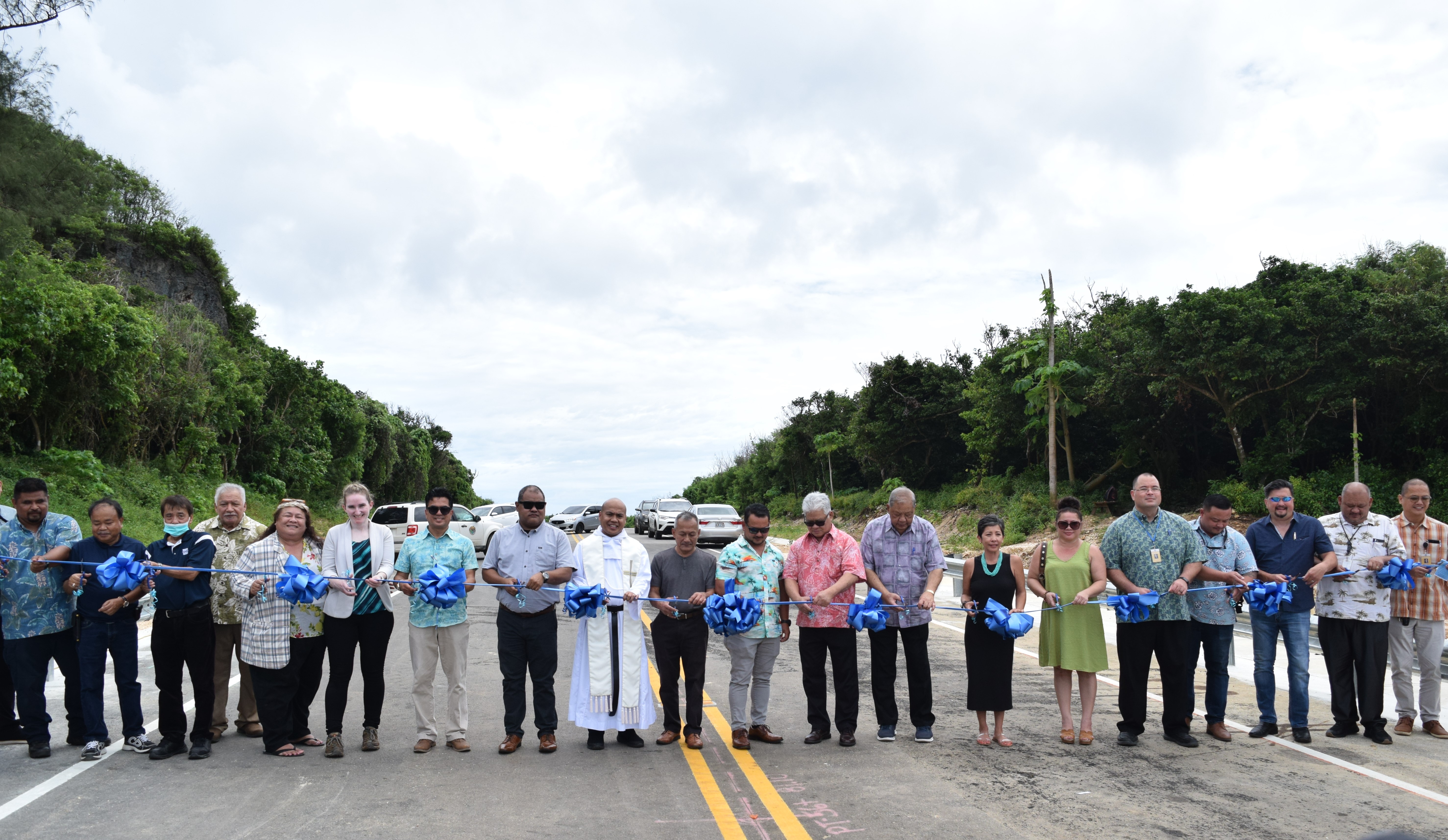 Gov. Arnold I. Palacios, Lt. Gov. David M. Apatang, Federal Highway Administration-Hawaii Division Territorial Representative Gabrielle Gersh, P.E, Department of Public Works Secretary Ray N. Yumul, Father Enrico Narcoda and lawmakers cut the ceremonial ribbon to mark the opening of Route 36 or Windward/Kalabera Road on Tuesday.