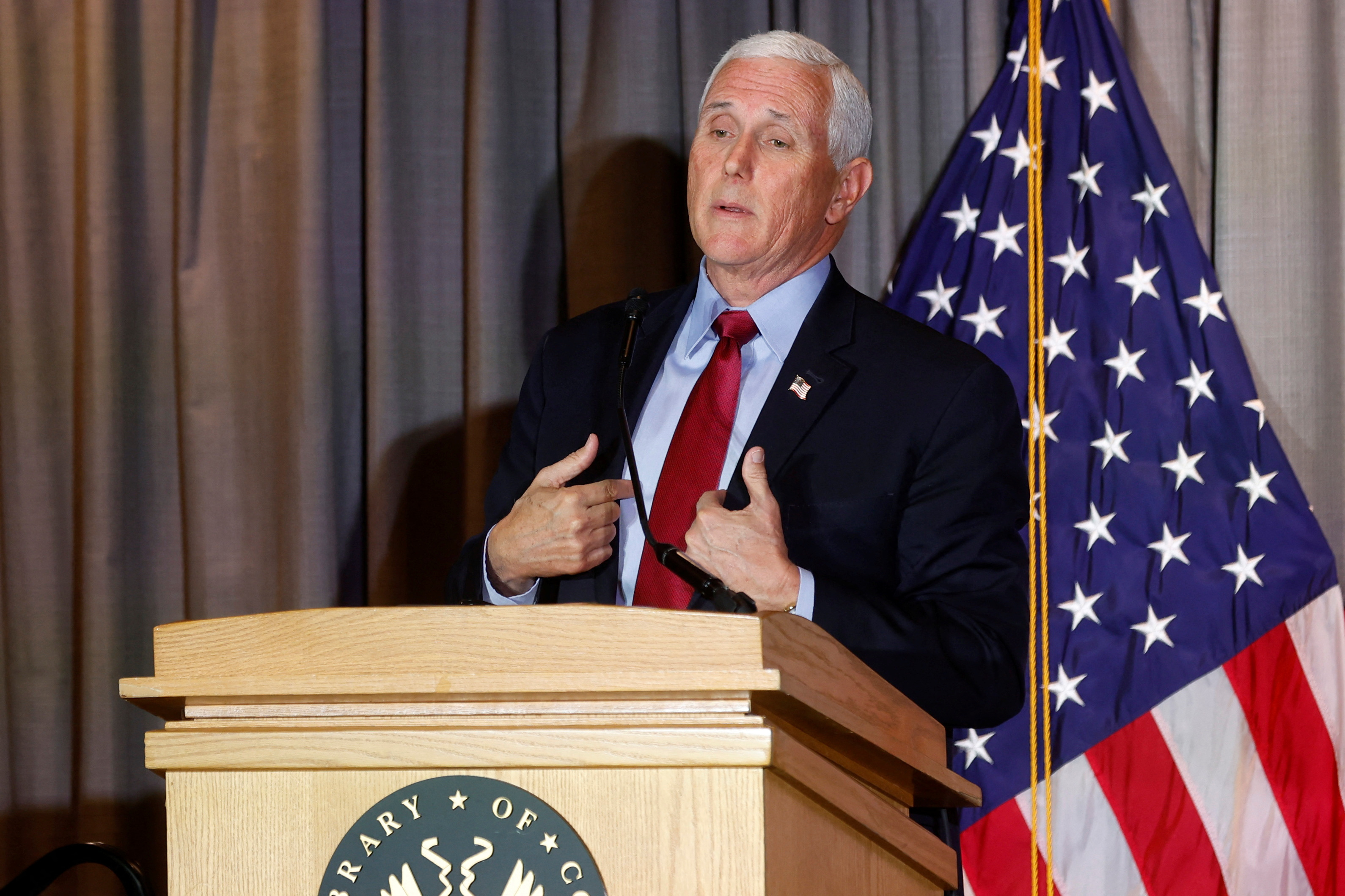 Former U.S. Vice President Mike Pence delivers remarks, in part addressing his opposition to a grand jury subpoena for testimony about efforts to overturn then-President Donald Trump's 2020 reelection loss, to the Coolidge Presidential Foundation conference at the Library of Congress in Washington, U.S. February 16, 2023. REUTERS/Jonathan Ernst