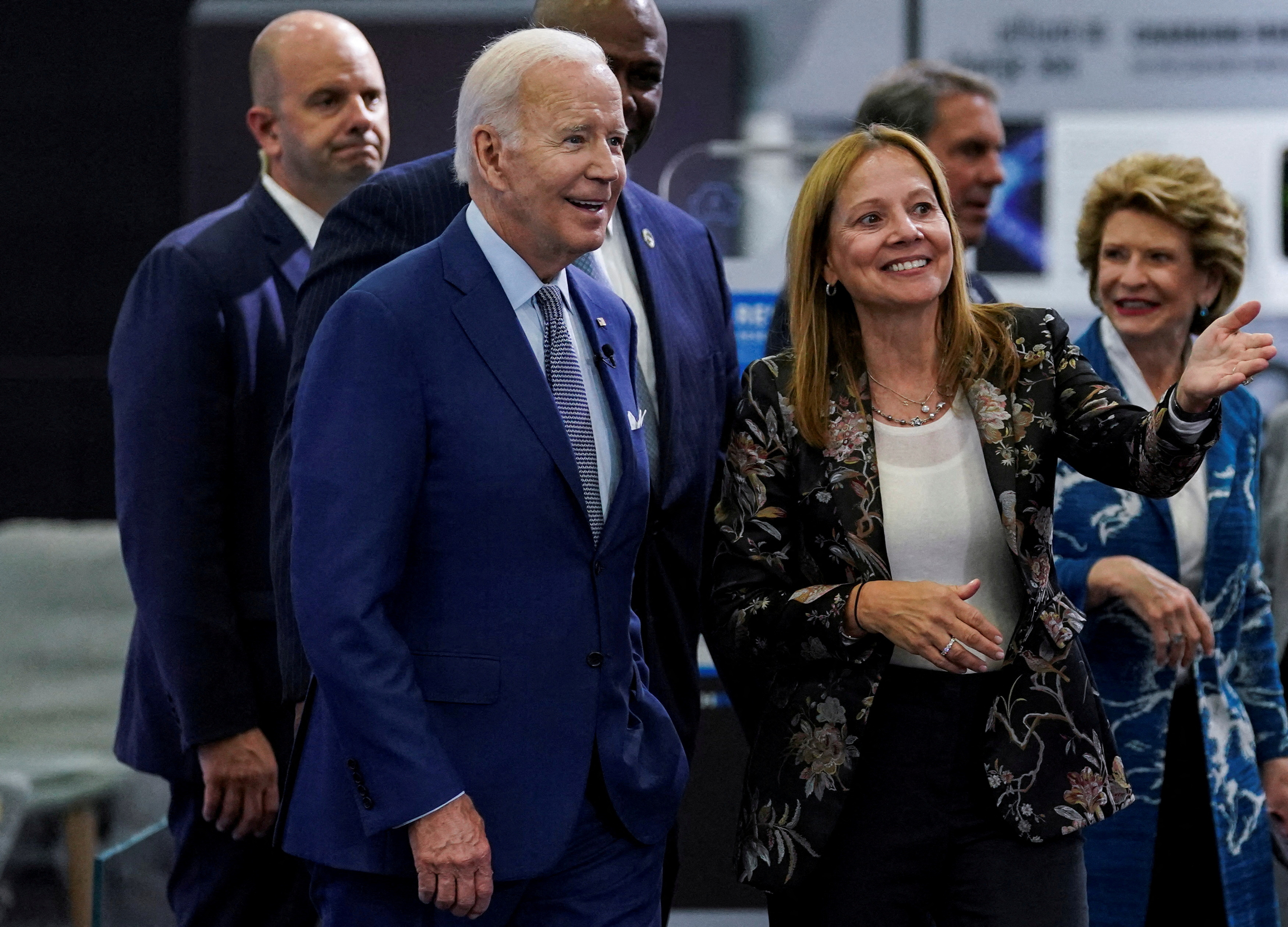 U.S. President Joe Biden listens to General Motors Chief Executive Mary Barra during a visit to the Detroit Auto Show to highlight electric vehicle manufacturing in America, in Detroit, Michigan, U.S., September 14, 2022. 