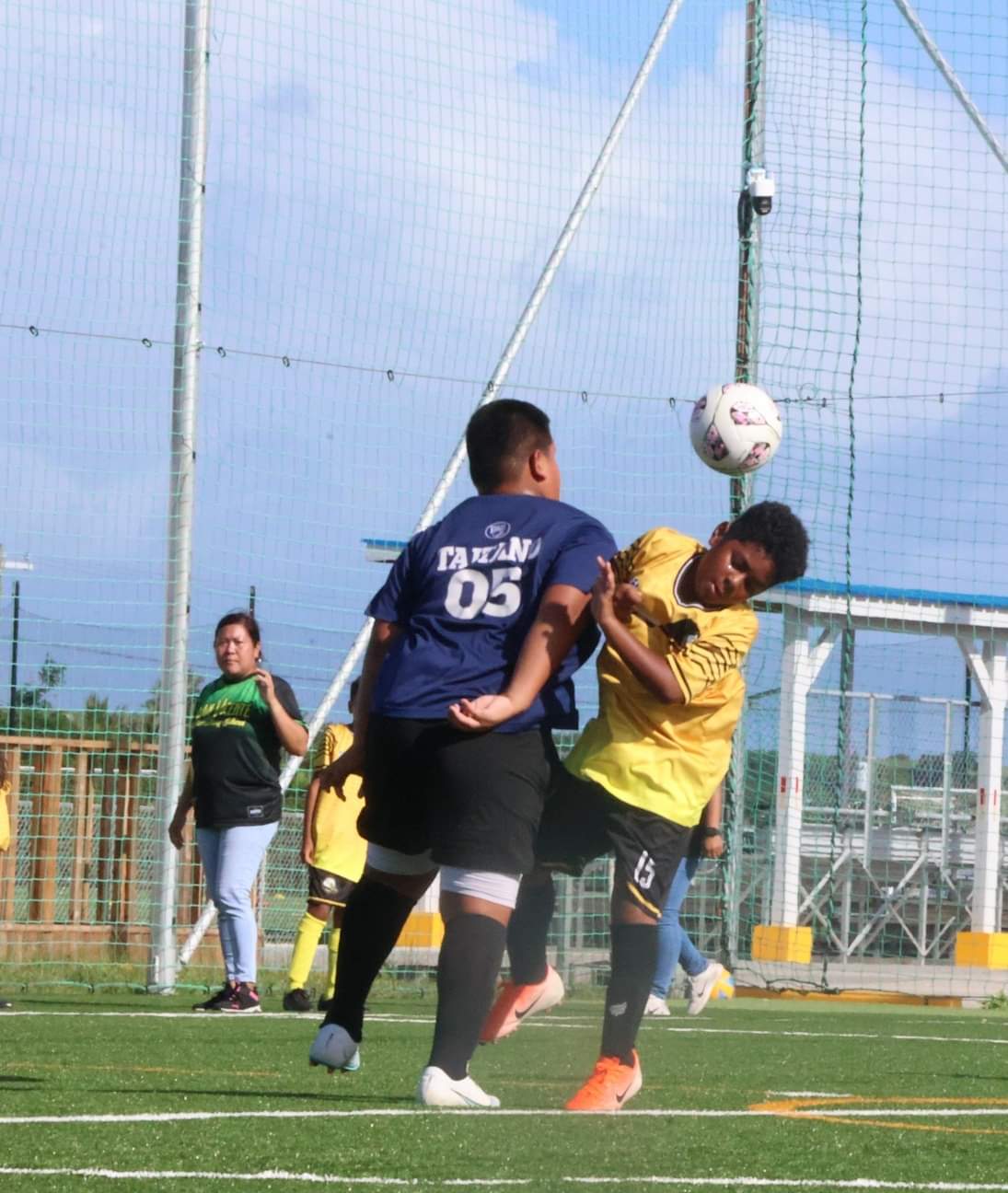 A Grace Christian Academy and San Vicente Elementary School player clash as they attempt a header in the battle for possession during an elementary division game of the NMIFA-PSS Interscholastic Soccer League SY23-24 on Wednesday at the NMI Soccer Training Center in Koblerville.