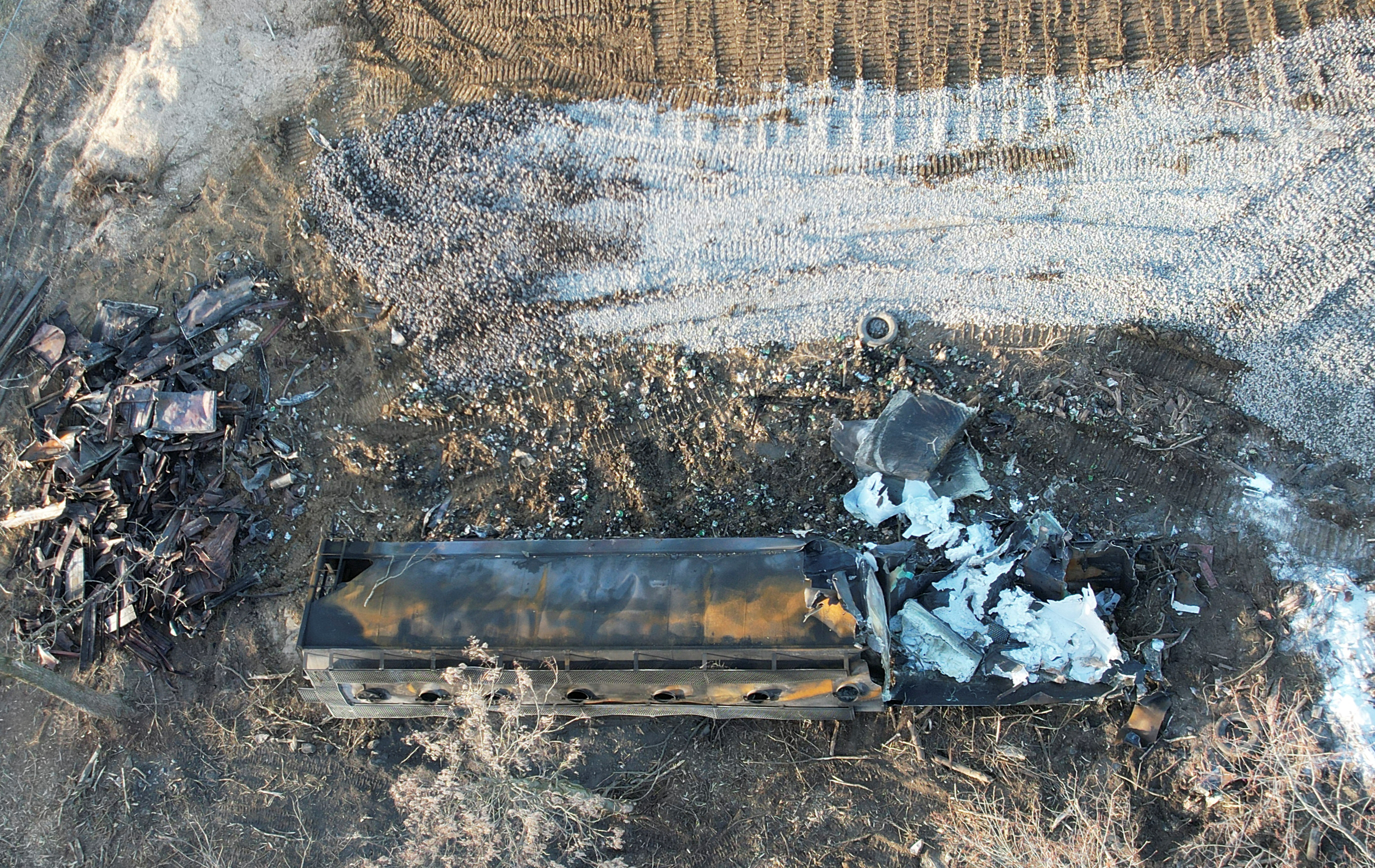 A burnt container is seen at the site where toxic chemicals were spilled following a train derailment, in East Palestine, Ohio, U.S., February 15, 2023. 