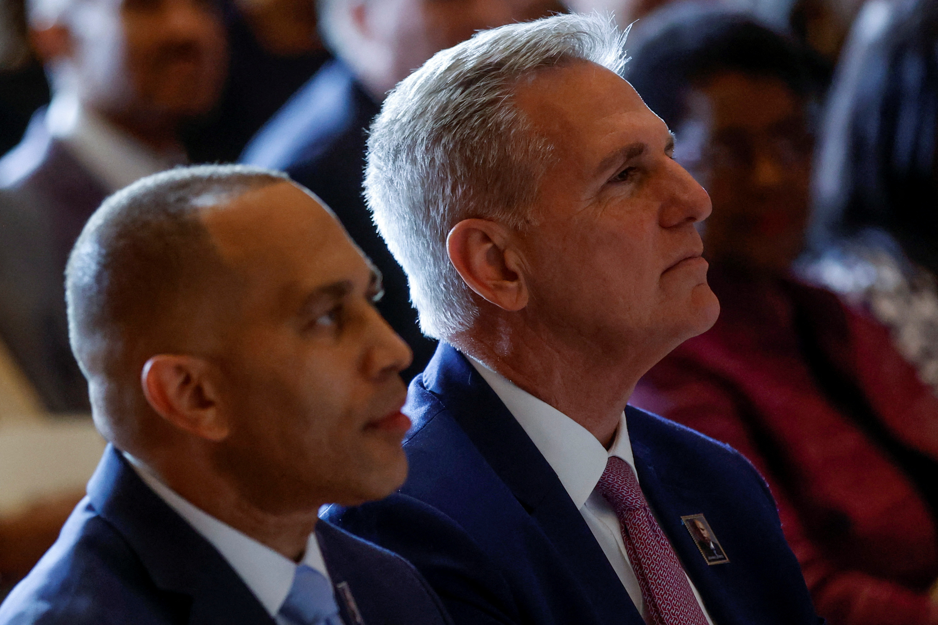 U.S. House Speaker Kevin McCarthy (R-CA) and House Minority Leader Hakeem Jeffries (D-NY) sit together before unveiling a postage stamp honoring Civil Rights icon and former U.S. Representative John Lewis (D-GA) at the U.S. Capitol in Washington, U.S. June 21, 2023. 