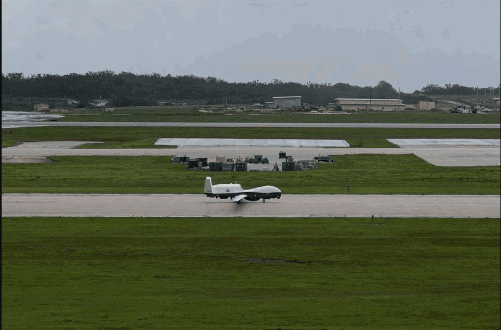 An MQ-4C Triton Unmanned Aircraft System taxis after landing at Andersen Air Force Base. VUP-19, the first Triton unmanned aircraft systems squadron, will operate and maintain the aircraft in Guam as part of initial operational capability.