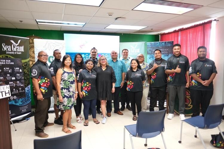 Lt. Gov. Josh Tenorio, center; Sharlene Santos-Bamba, senior vice president and provost of the University of Guam, left of Tenorio; and Austin Shelton, director of UOG Center for Island Sustainability, right of Tenorio; join the first cohort of the 2030 Islands Network Conservation Corps at the UOG residence hall on Friday, Sept. 1, 2023.