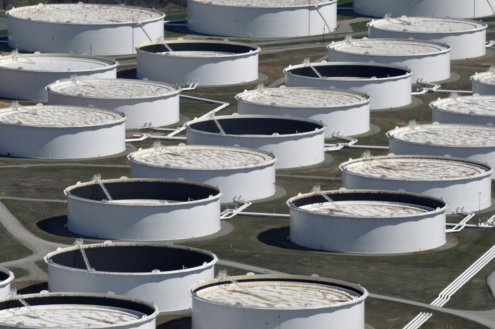 Crude oil storage tanks are seen from above at the Cushing oil hub, appearing to run out of space to contain a historic supply glut that has hammered prices, in Cushing, Oklahoma, March 24, 2016.