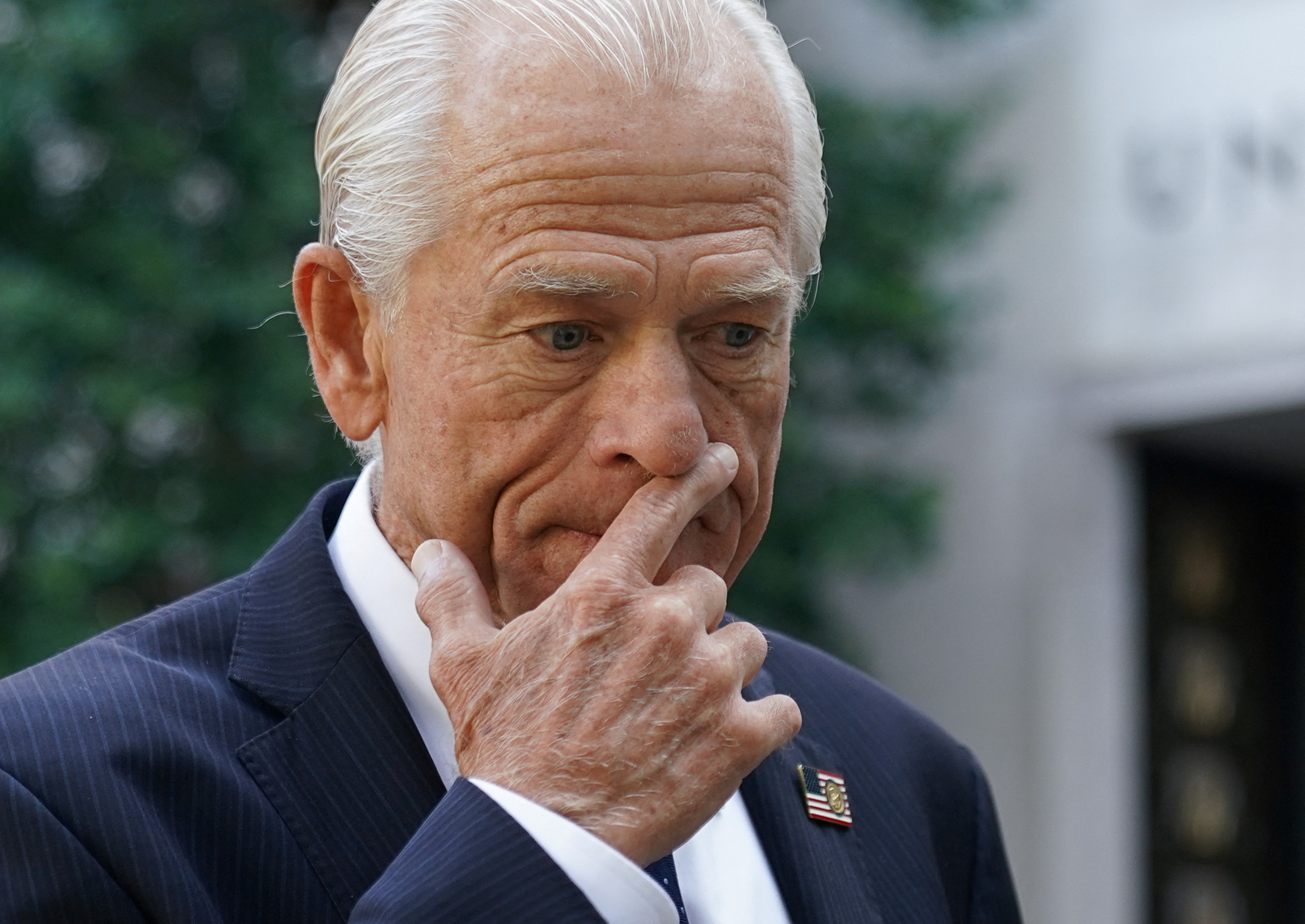 Peter Navarro, adviser to former U.S. President Donald Trump, stops to speak as he arrives for opening arguments in his trial on contempt of Congress charges for refusing to cooperate with the House of Representatives committee investigating the January 6, 2021 attack on the Capitol, at U.S. District Court in Washington, U.S., September 6, 2023. REUTERS/Kevin Lamarque