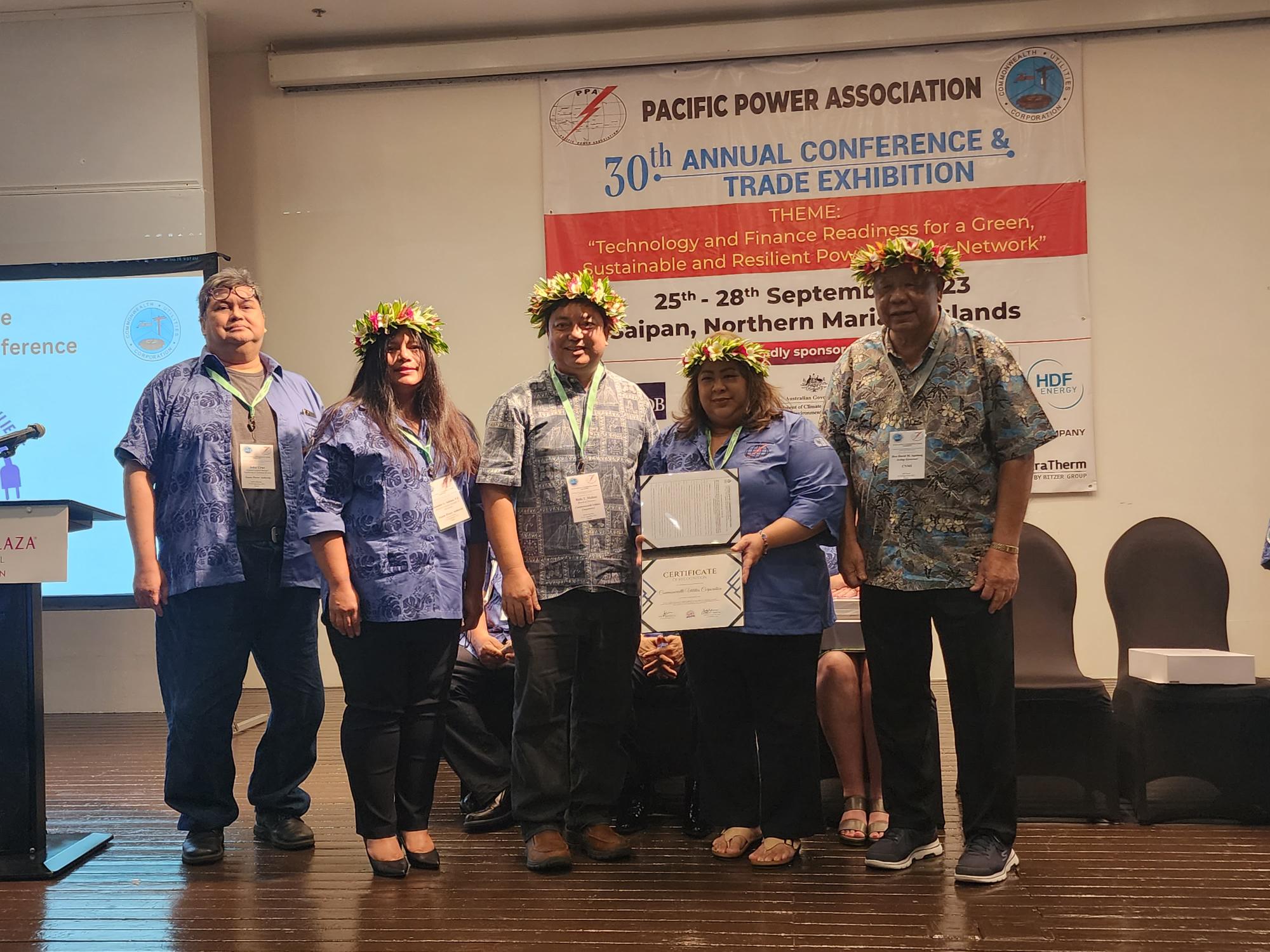Guam Power Authority Assistant Manager Jennifer Sablan P.E presents a certificate of appreciation and resolution to Commonwealth Utilities Corp. acting Executive Director Betty Terlaje, Acting Gov. David Apatang, and CUC Board  Member Rufo Mafnas during the 30th Pacific Power Association Annual Conference and Trade Exhibition on Tuesday at Crowne Plaza Resort.
