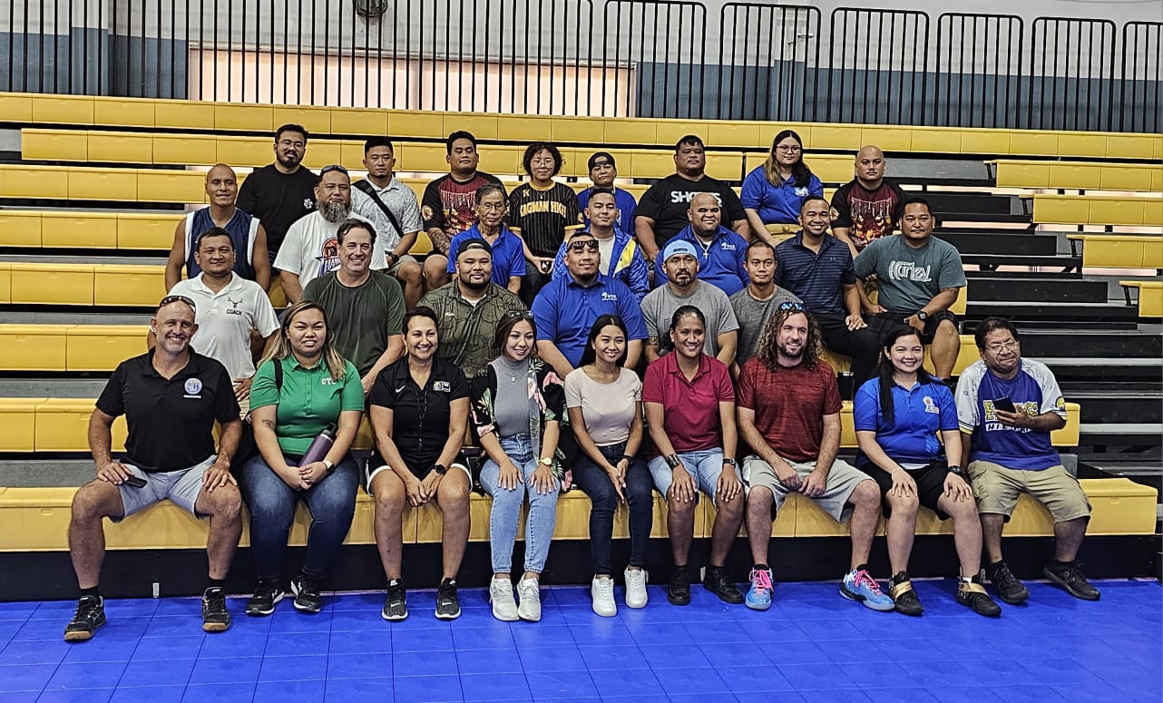 Public School System teachers pose with Annie La Fleur following the coaches workshop she conducted Tuesday at the Ada gym. 