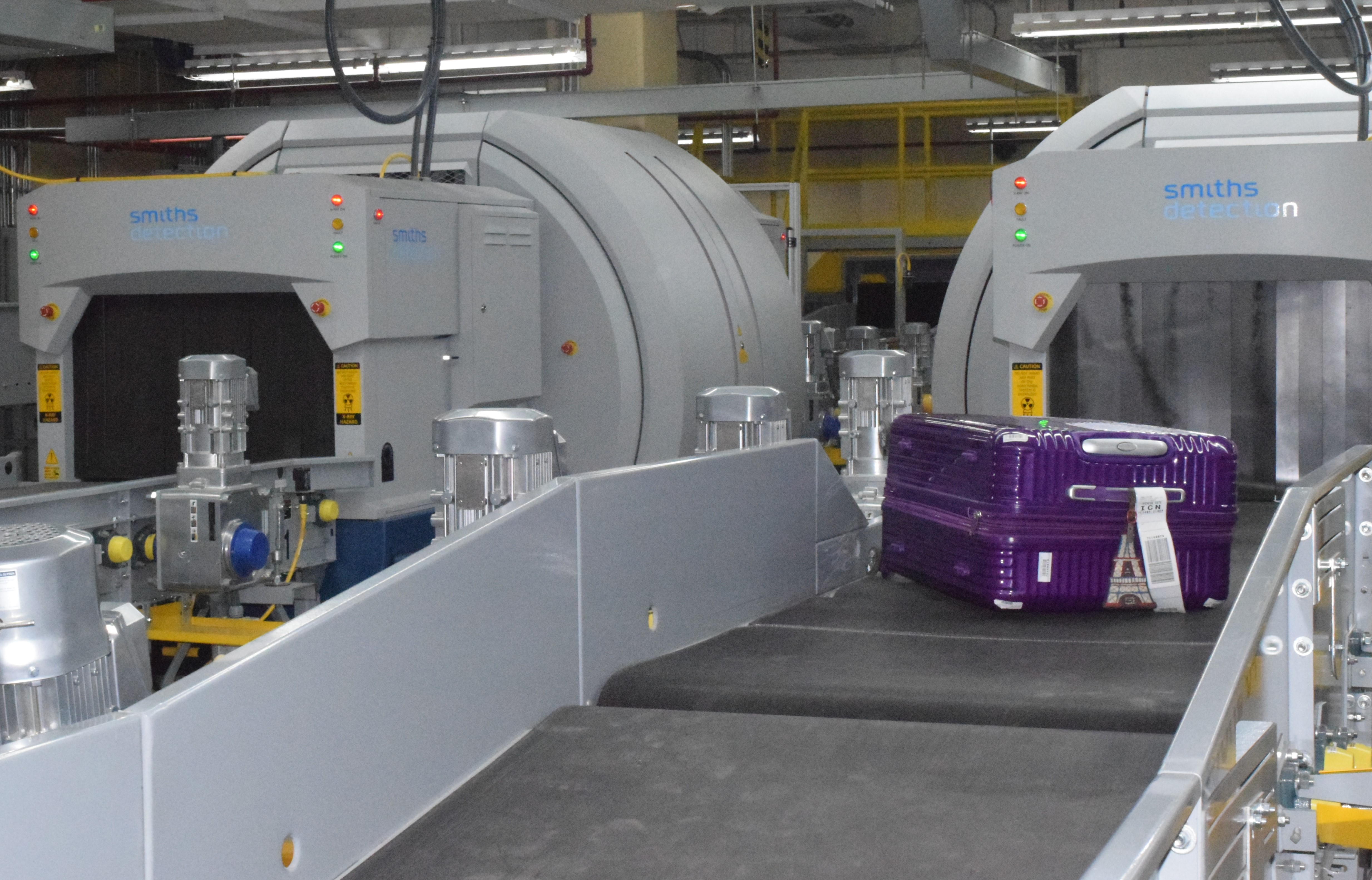 A piece of luggage emerges from the Explosive Detection System, which is a key component of the newly installed Checked Baggage Inspection System at the Francisco C. Ada/Saipan International Airport on Thursday.