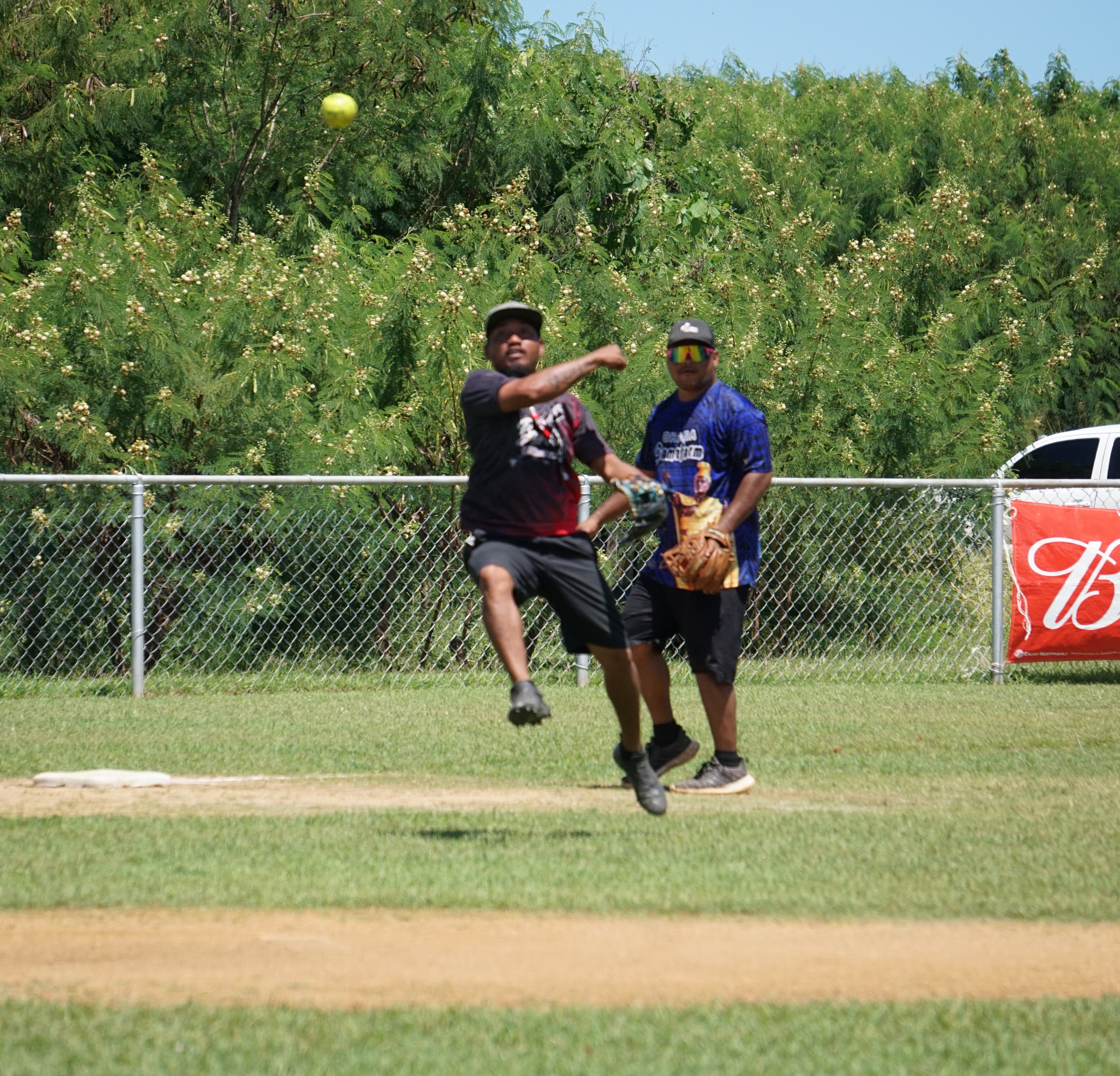 Dat's It pitcher Jon Welson attempts an off-balance throw to first base during a game against the Blue Jays in the 2023 Budweiser Belau Amateur Softball Association Open League on Sunday at the Dandan baseball field.