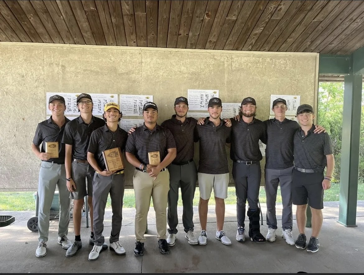 Sebastian Camacho, fourth left, poses with his teammates after  they successfully defended the Ottawa Golf University Invitational title at Eagle Bend Golf and Country Club.