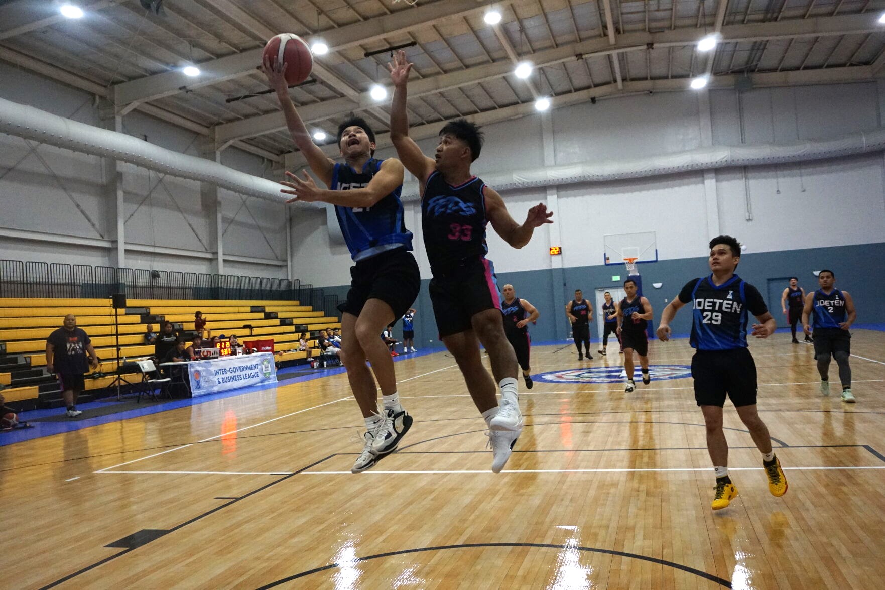 Federals' Leo Apelo attempts the chase-down block during a basketball game against Joeten in the R&J Wine & Liquor Inter-Government/Business League at the Ada gym.