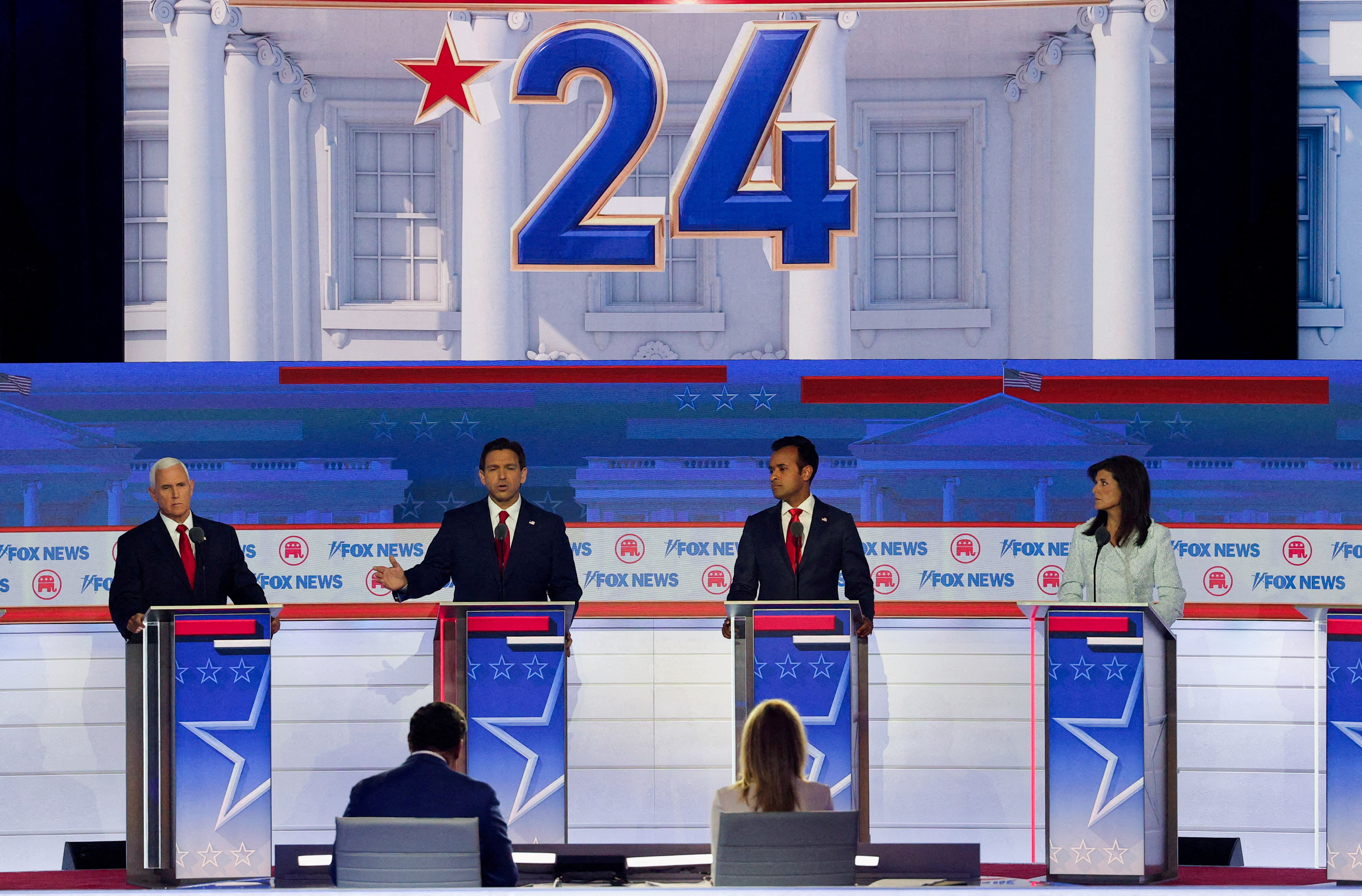 Florida Governor Ron DeSantis speaks as former U.S. Vice President Mike Pence, former biotech executive Vivek Ramaswamy and former South Carolina Governor Nikki Haley listen during the first Republican candidates' debate of the 2024 U.S. presidential campaign in Milwaukee, Wisconsin, U.S. August 23, 2023. REUTERS/Brian Snyder/File Photo