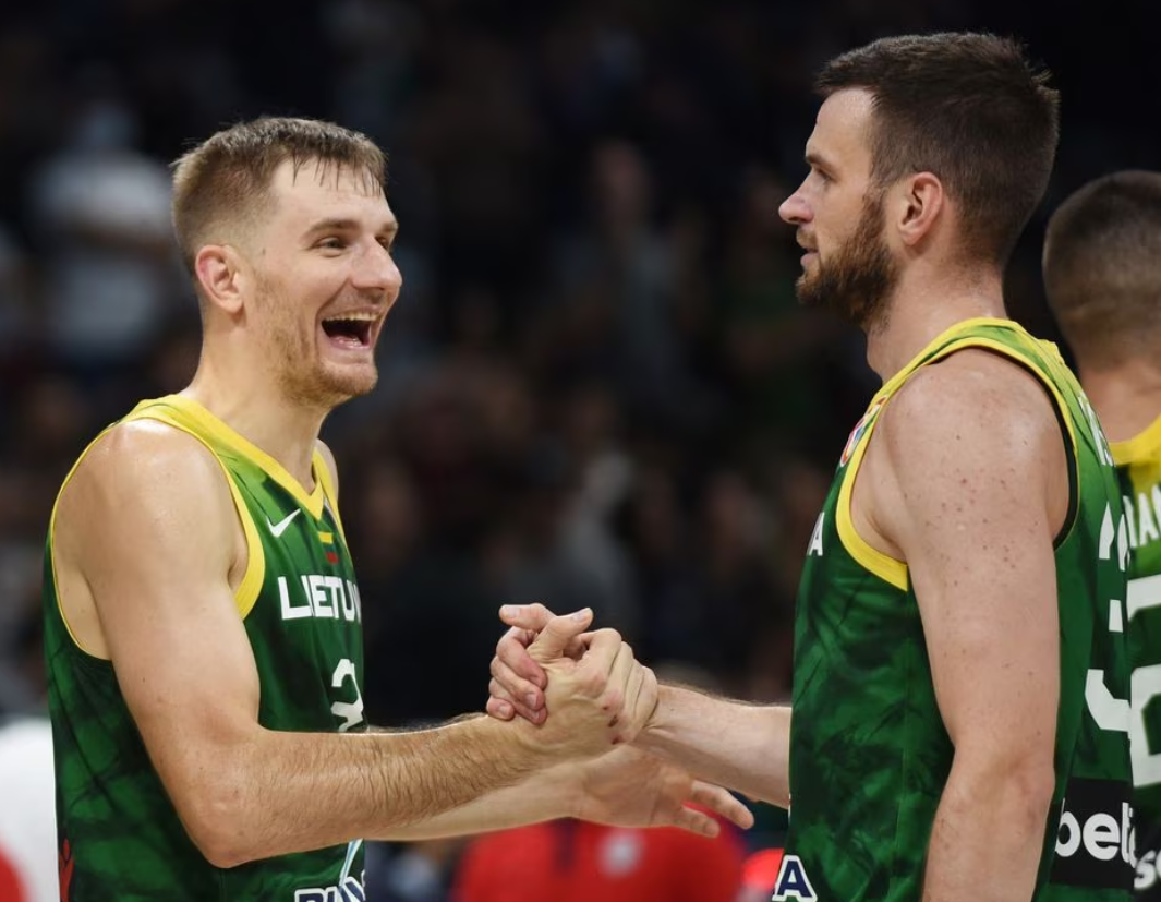 Lithuania's Vaidas Kariniauskas and Tomas Dimsa celebrate after defeating the U.S. in the Second Round of the FIBA World Cup 2023 at the Mall of Asia Arena in Manila, the Philippines, Sept. 3, 2023 