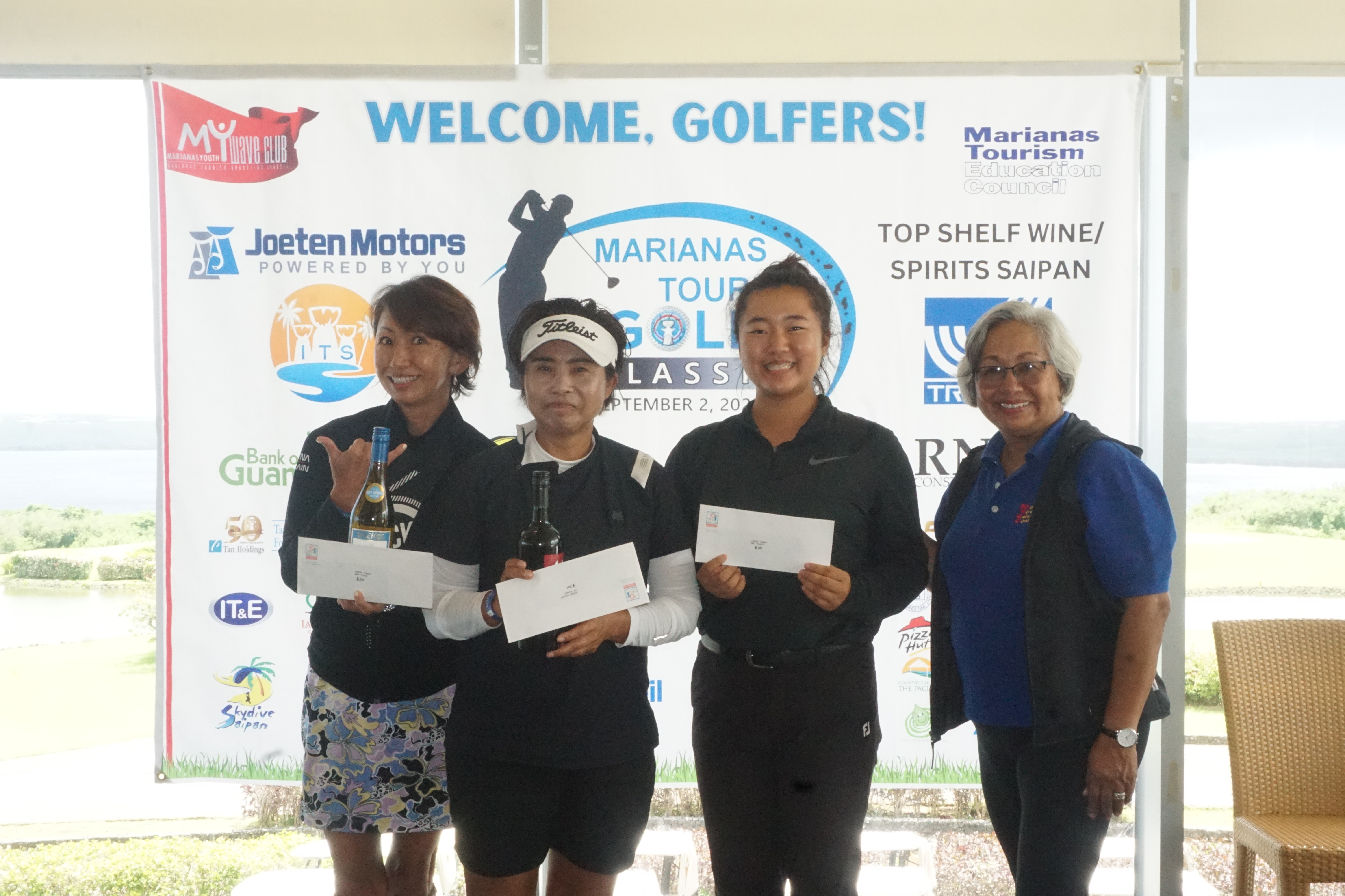 The top the winners of the Ladies flight — Yoo Young Hee, Yuko Togawa and Zhi Min Jin — pose for a photo with Marianas Tourism Education Council Chair Vicky Benavente during the awards ceremony of the 2023 Marianas Tourism Golf Classic on Saturday at Laolao Bay Golf & Resort.