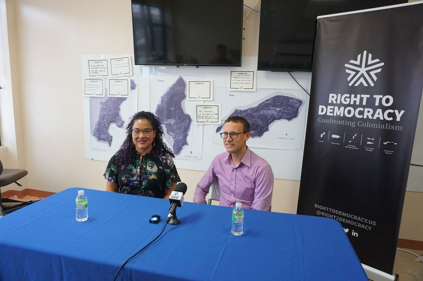 Right to Democracy cofounders Adi Martinez-Roman, left, and Neil Weare at a press conference on Saipan in August.
