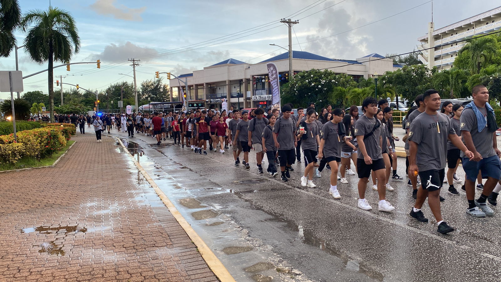 JROTC cadets march north in formation on Beach Road in Garapan during Light Up the Night March on Tuesday.