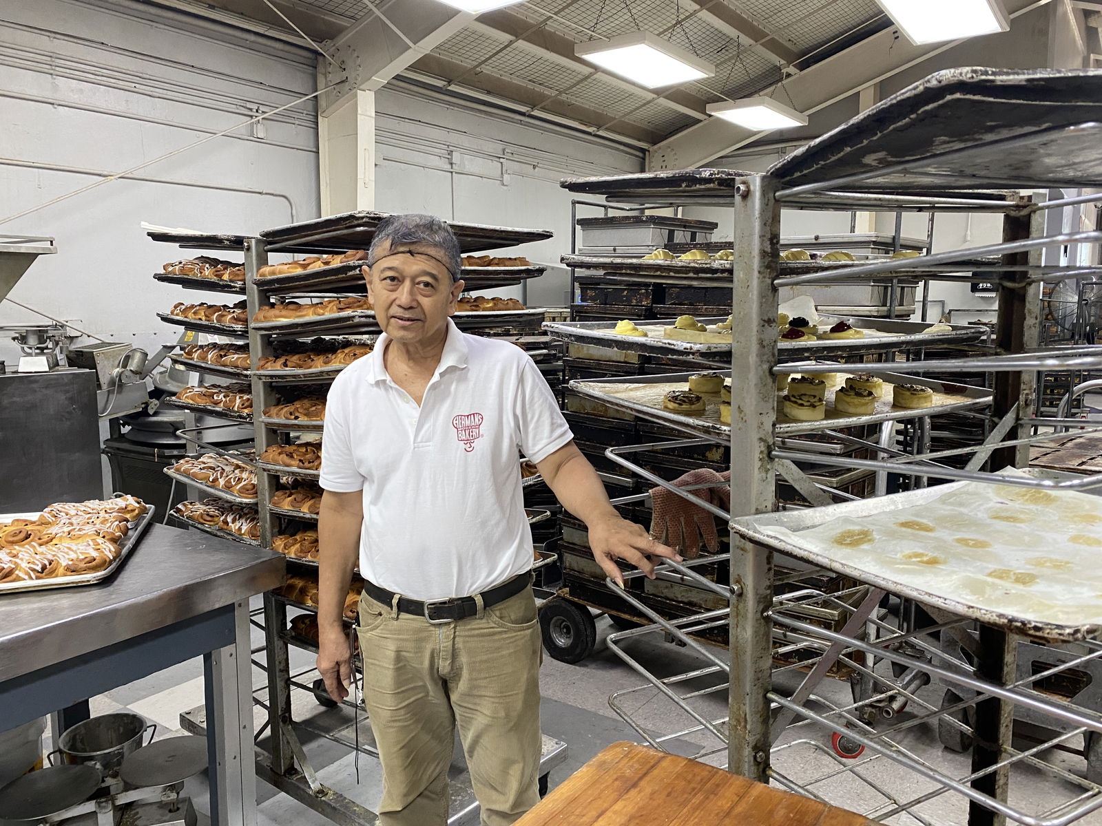 Ernie Lineses poses inside the commercial bakery where he made his career. 