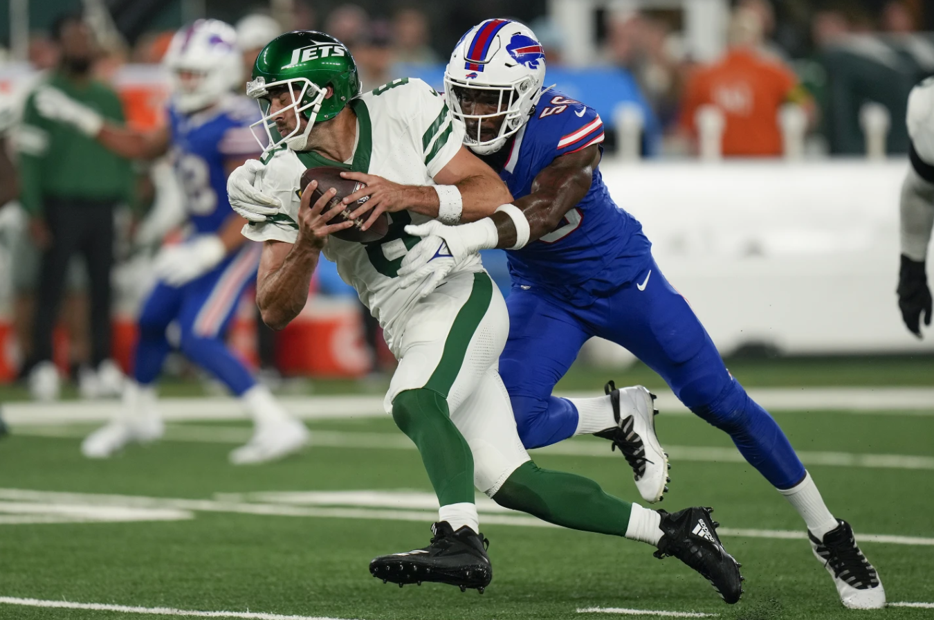 New York Jets quarterback Aaron Rodgers (8) is sacked by Buffalo Bills defensive end Leonard Floyd (56) during the first quarter of an NFL football game, Monday, Sept. 11, 2023 in East Rutherford, N.J.