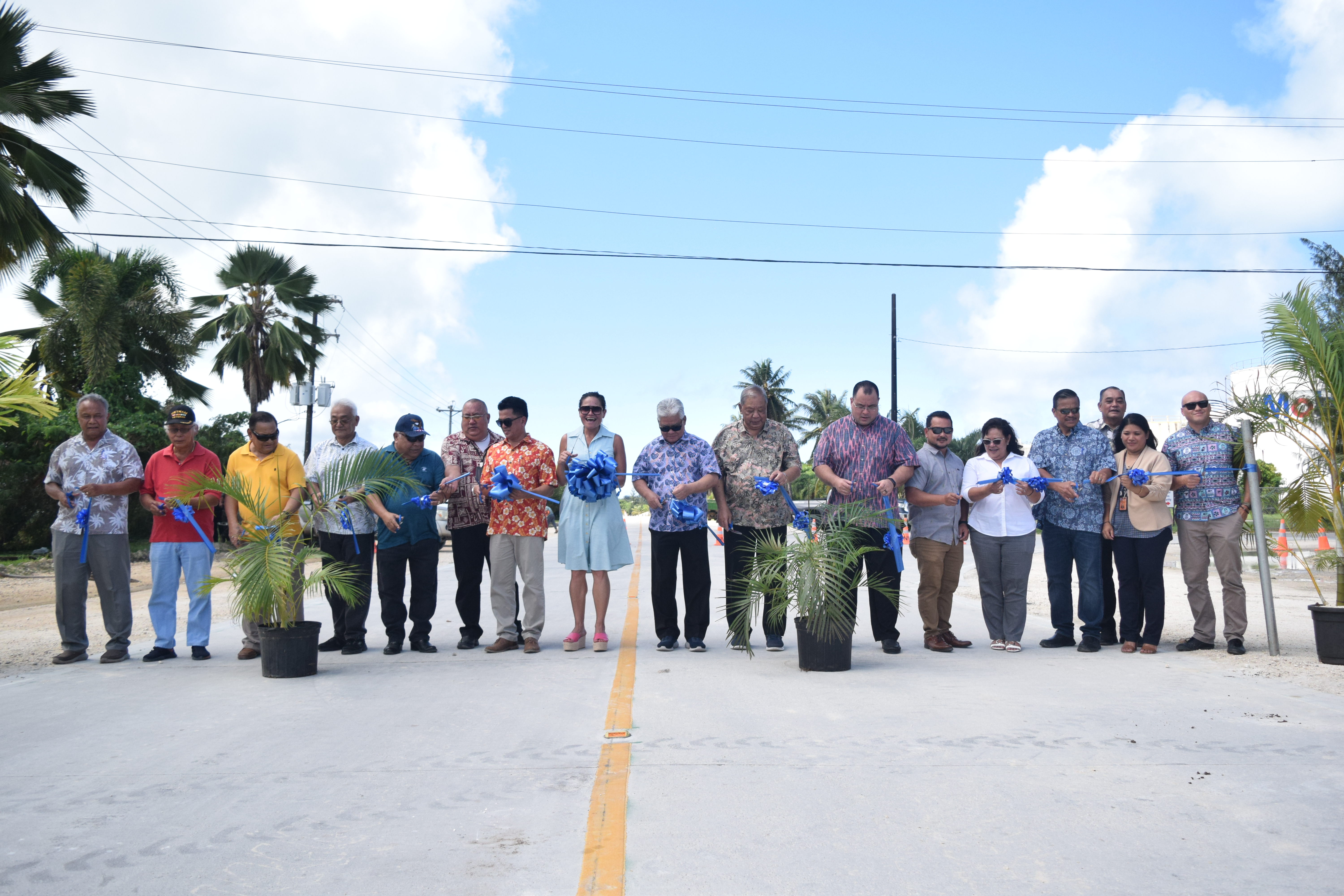 Gov. Arnold I. Palacios, center, and other CNMI officials cut the ceremonial ribbon for the newly paved Industrial Drive in Puerto Rico, Saipan, on Friday.
