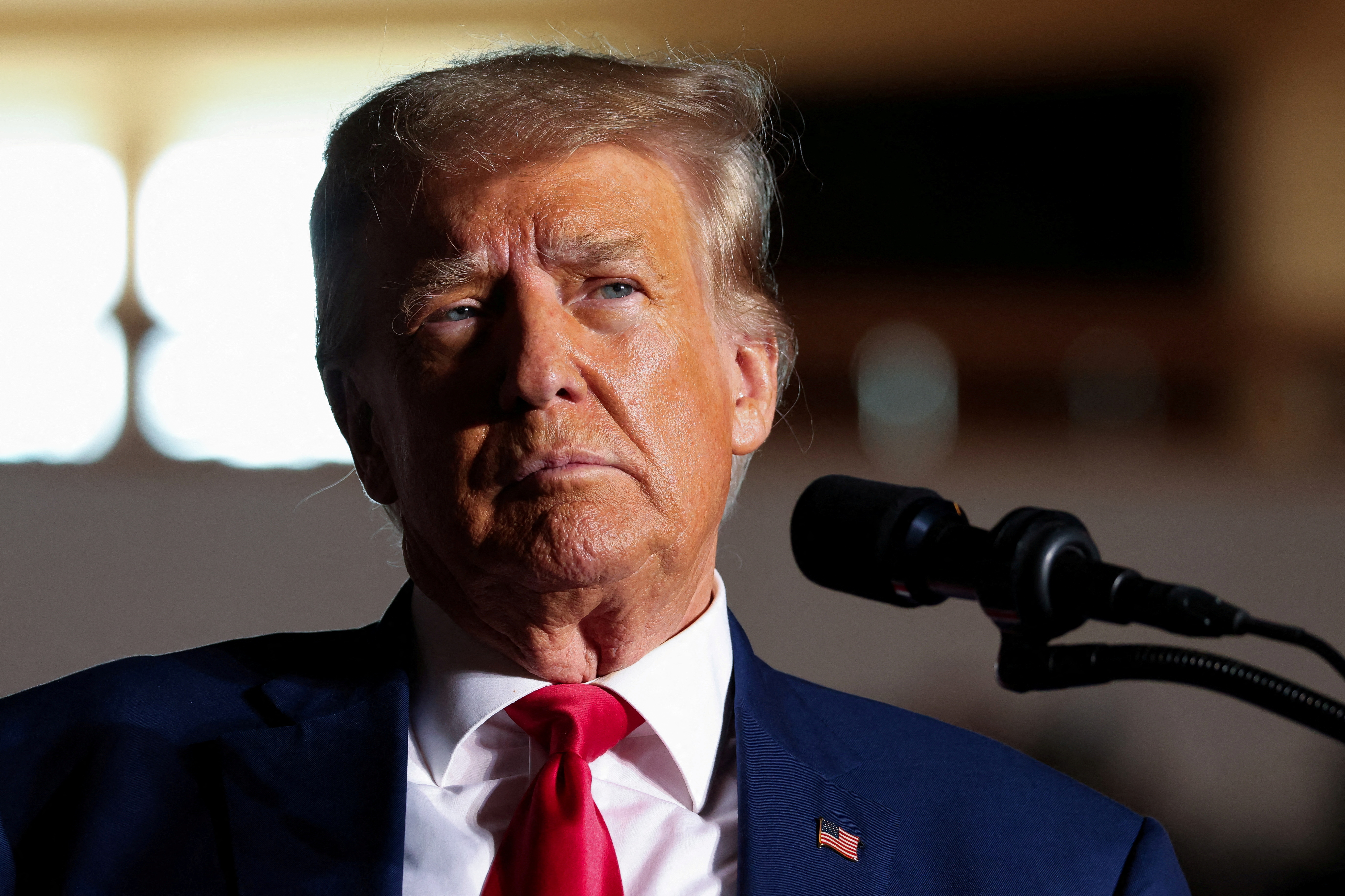 Former U.S. President and Republican presidential candidate Donald Trump reacts as he holds a campaign rally in Erie, Pennsylvania, U.S., July 29, 2023. REUTERS/Lindsay DeDario/File Photo