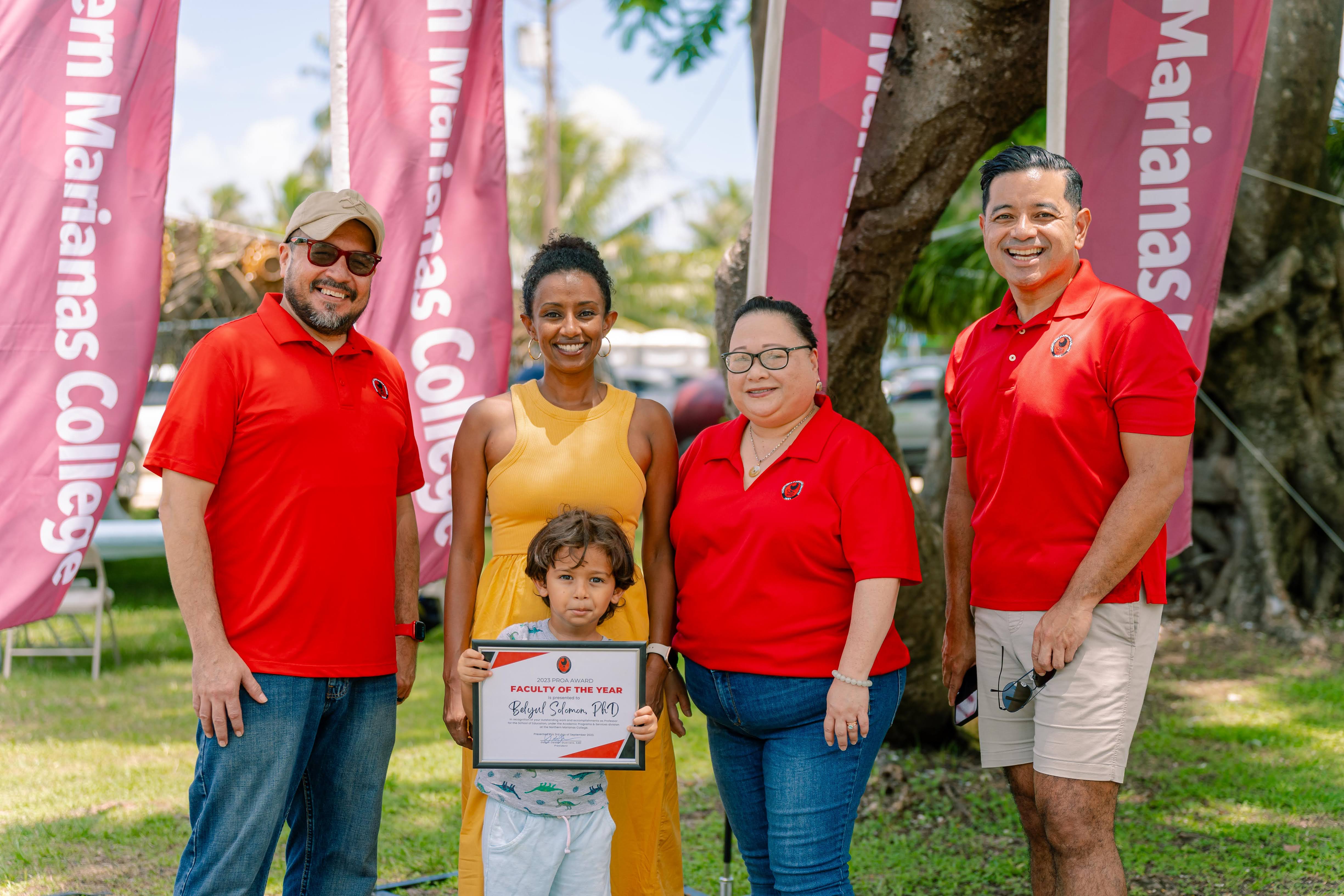 Faculty of the Year Dr. Beylul Solomon with her son Yosef William Fife IV, NMC President Galvin Deleon Guerrero, EdD, Interim Dean for Academic Programs and Services Lorraine Maui, and NMC Vice President for Administration and Advancement Frankie Eliptico.
