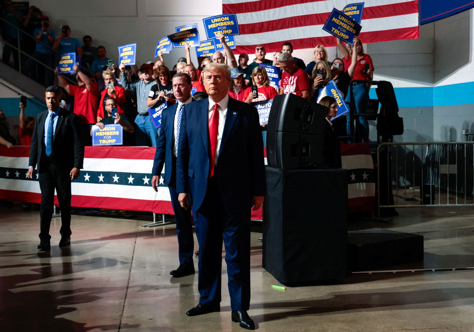 Former U.S. President and Republican presidential candidate Donald Trump looks on while his supporters cheer on the day he addresses auto workers as he skips the second GOP debate, in Clinton Township, Michigan, U.S., September 27, 2023. REUTERS/Rebecca Cook