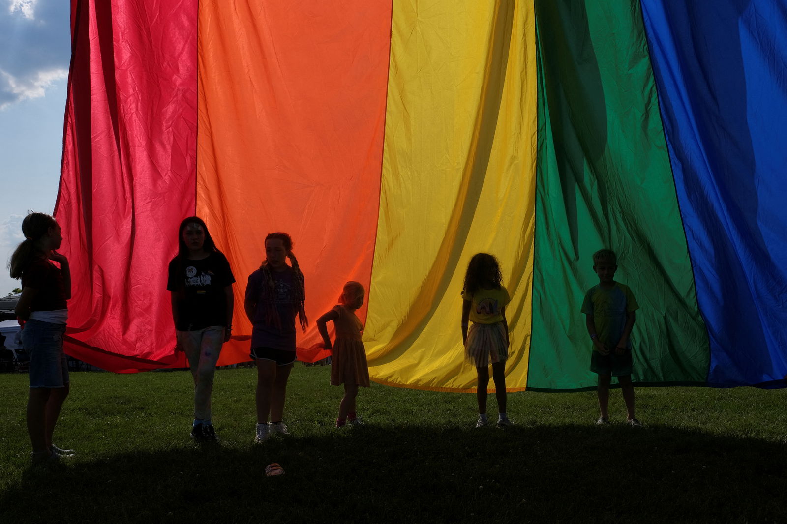 Children of attendees hold the rainbow flag during an all ages LGBTQ Pride event in Franklin, Tennessee, U.S., June 3, 2023. 