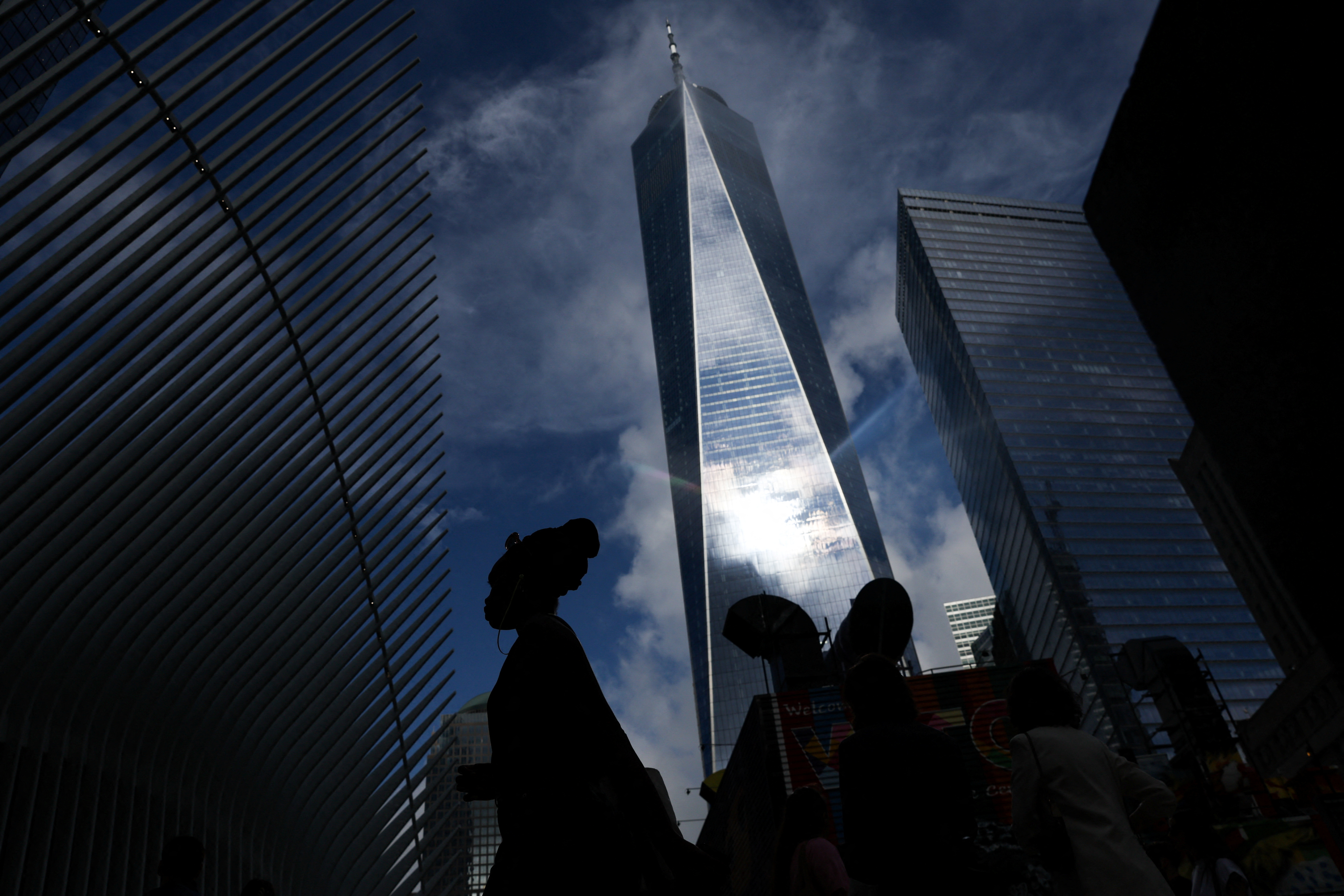 People walk at One World Trade Center on the day of the 22nd anniversary of the September 11, 2001 attacks, in New York City, U.S., September 11, 2023.
