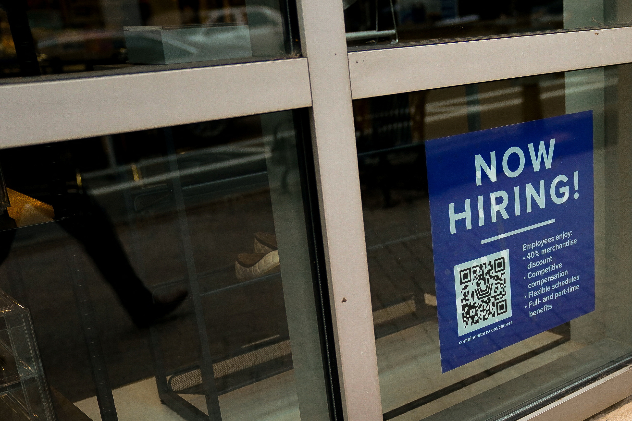 An employee hiring sign with a QR code is seen in a window of a business in Arlington, Virginia, U.S., April 7, 2023. REUTERS/Elizabeth Frantz/File Photo